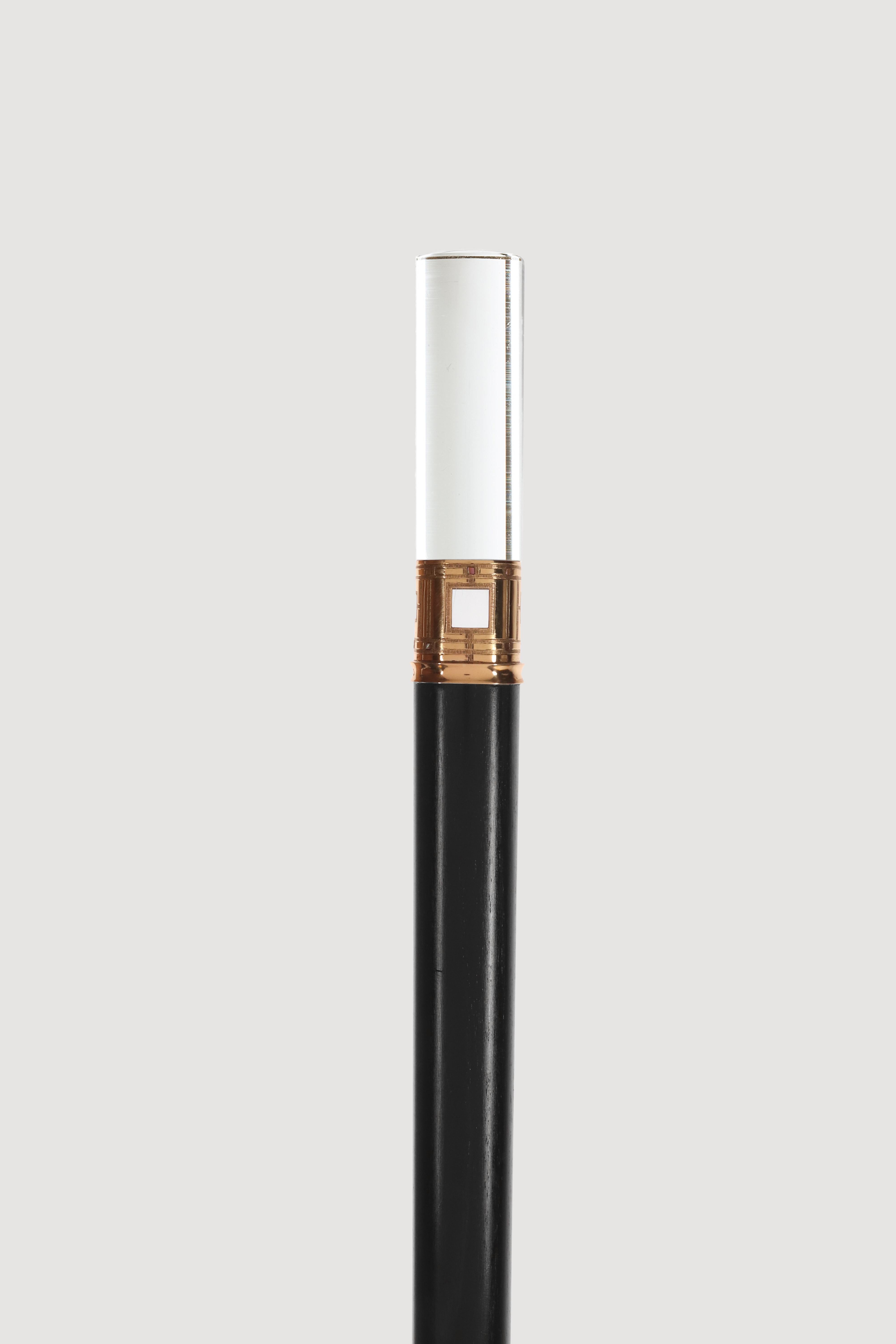 Art Decò walking stick: jewel cane, cylindrical knob in rock crystal, band made of 18Kt gold, fretwork, 4 squares of two sizes, which allow you to see the rock crystal underneath, with engravings and small squares in Abalone mother-of-pearl