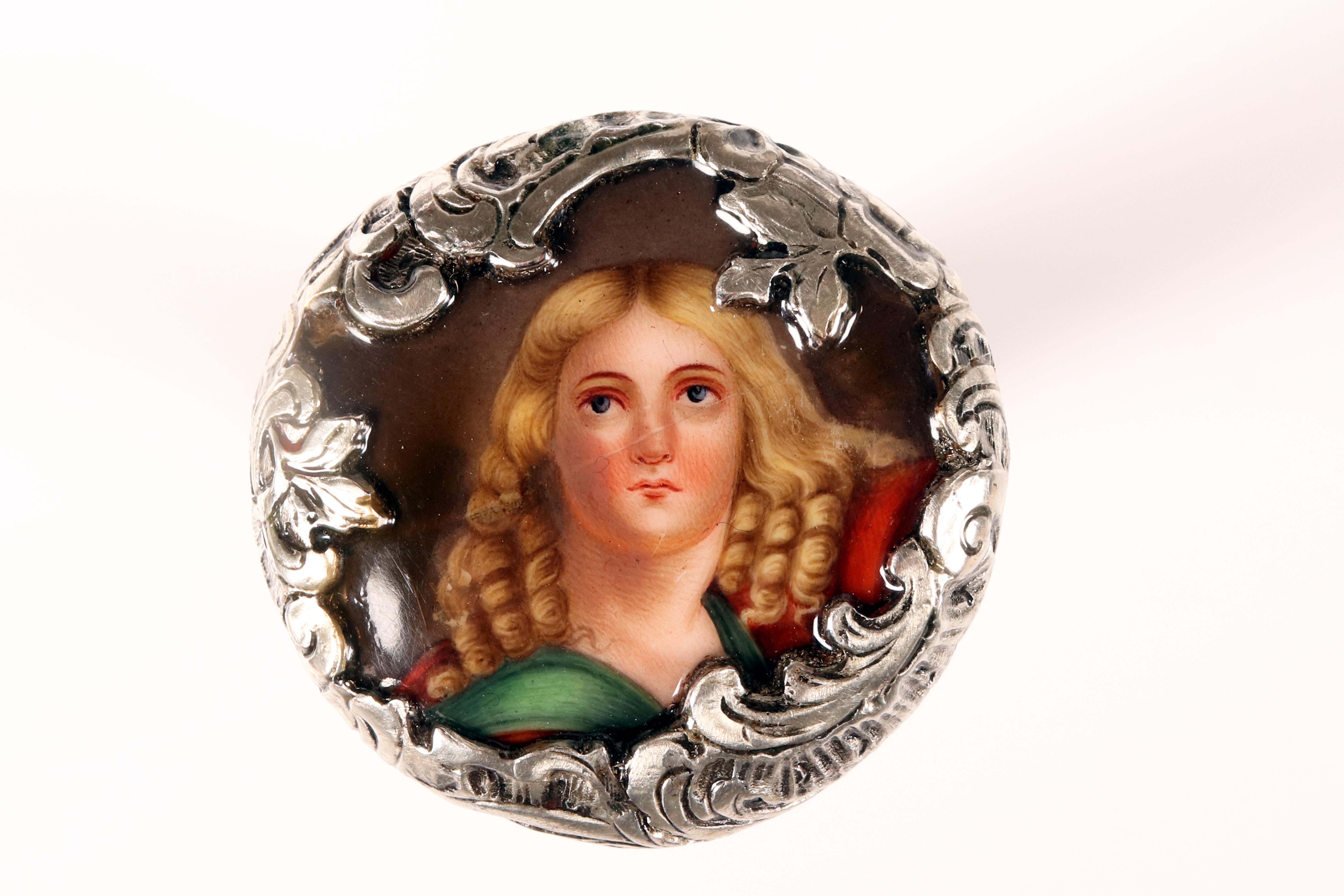 Walking stick: jeweled walking stick, silver knob in the shape of a milord worked in tourchon, with finely engraved and gilded parts. At the top of the knob, a miniature painted in enamel on porcelain of Saint Luke is set. The Pre-Raphaelite-style