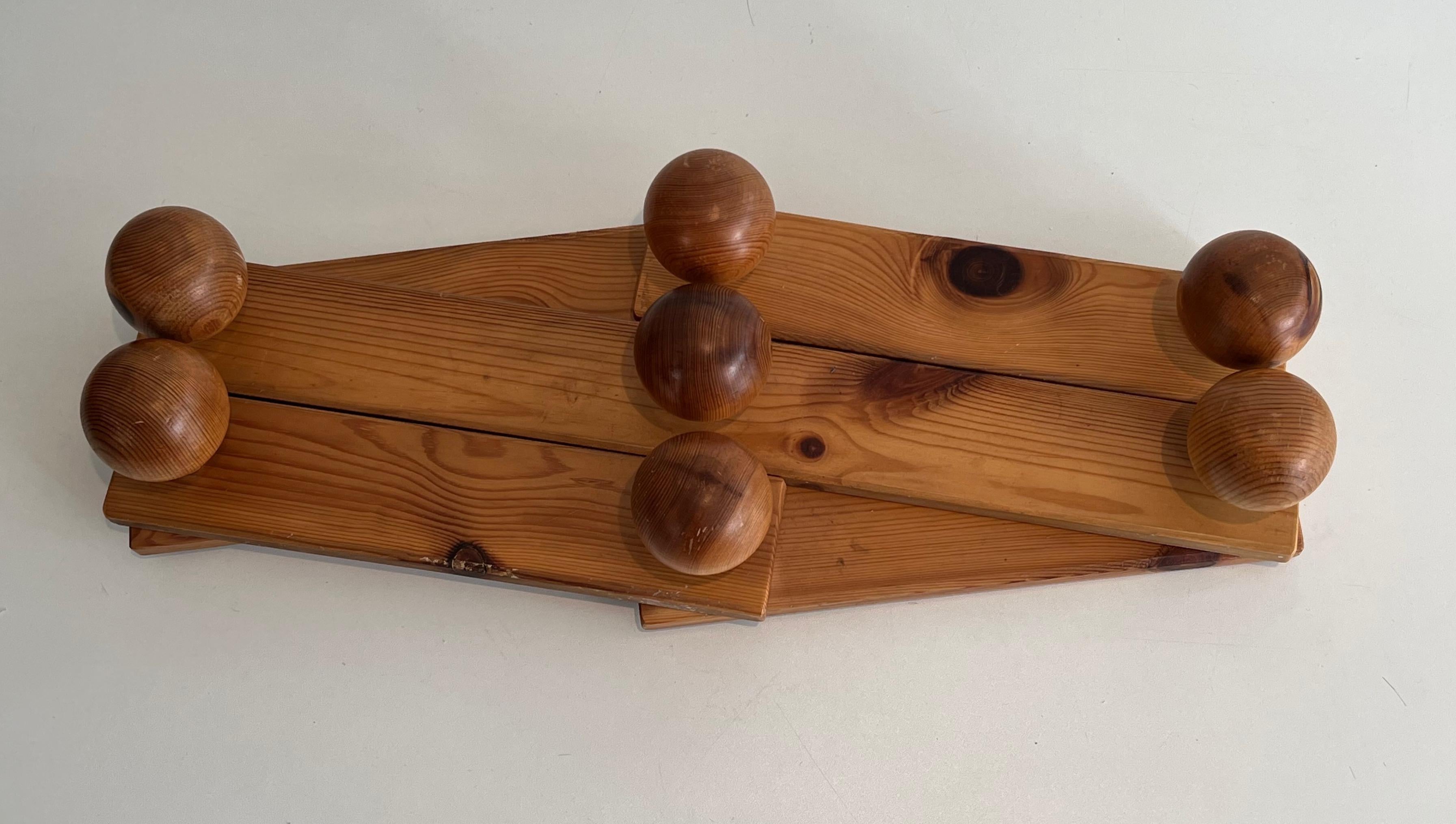 Mid-Century Modern Wall accordion coat hanger in pine. French work in the style of CharlottePerrand For Sale