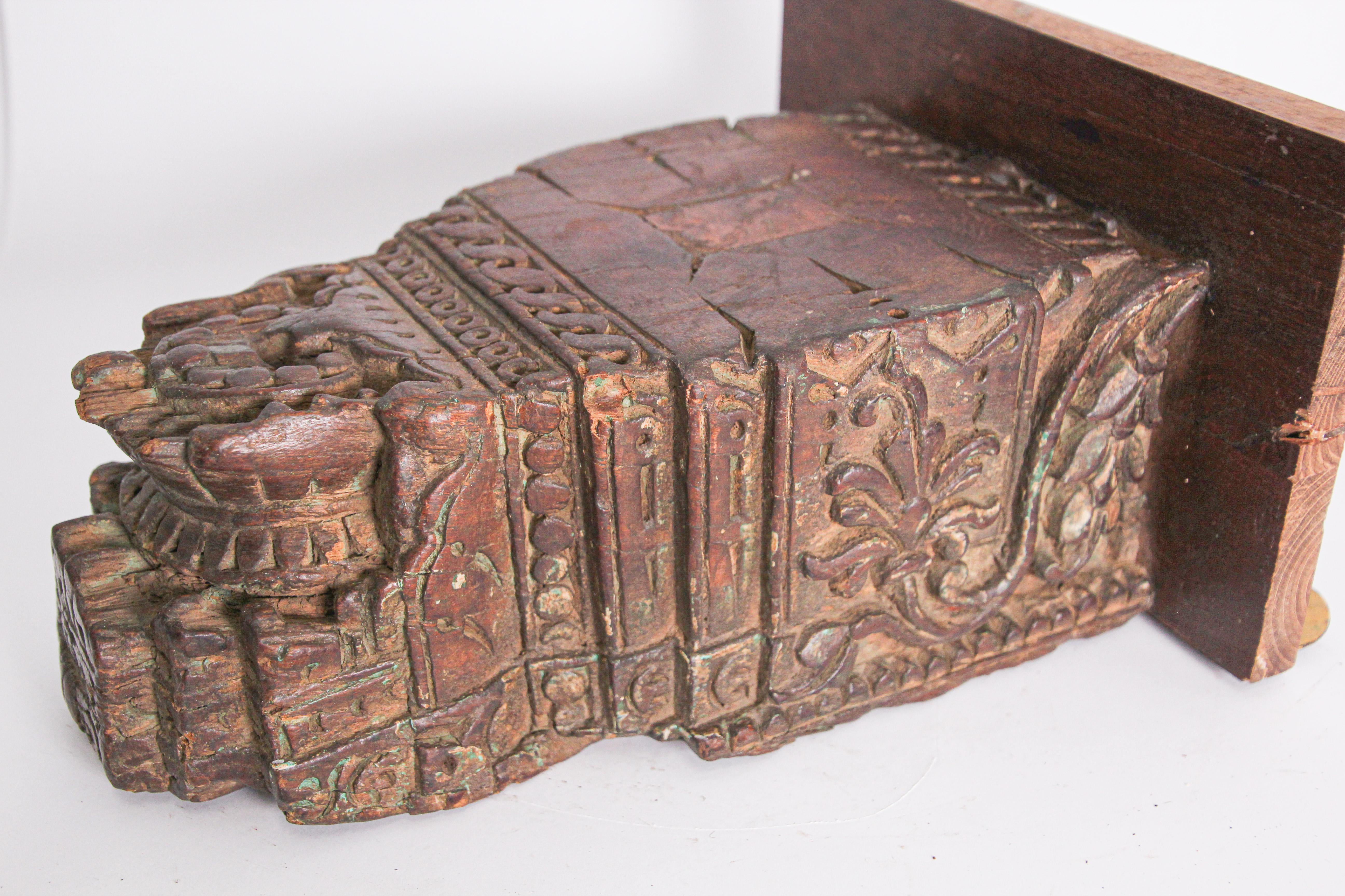 Antique architectural carved wood temple fragment from Rajasthan, India.
19th century Hindu temple fragment. This antique fragment were elements of a section of hand carved wood frieze, within a temple in India. Mounted on a custom-made,