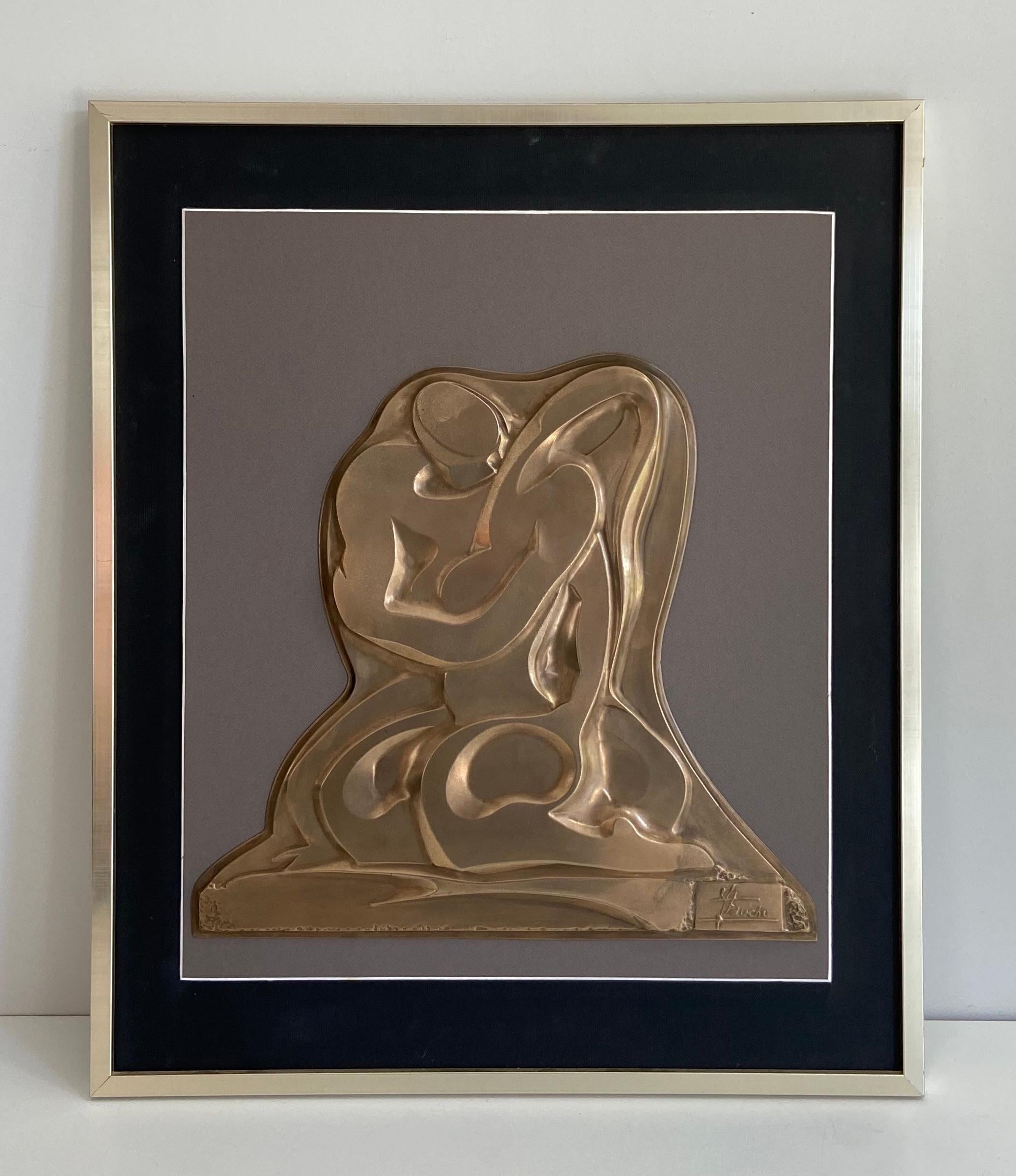 This wall sculpture showing a couple is made of brass. This is a French work, signed. Circa 1970
