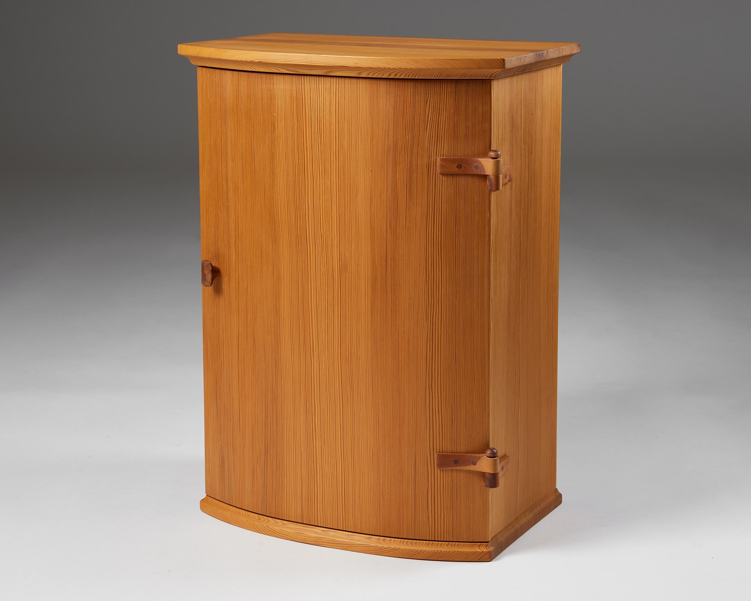 Wall cabinet, anonymous.
Sweden. 1960s.

Pine.

Measures: 
H: 56 cm
W: 41 cm
D: 26 cm
Interior D: 19-23 cm
Height between shelves: 19.5 cm and 22 cm
Drawer height: 7 cm
