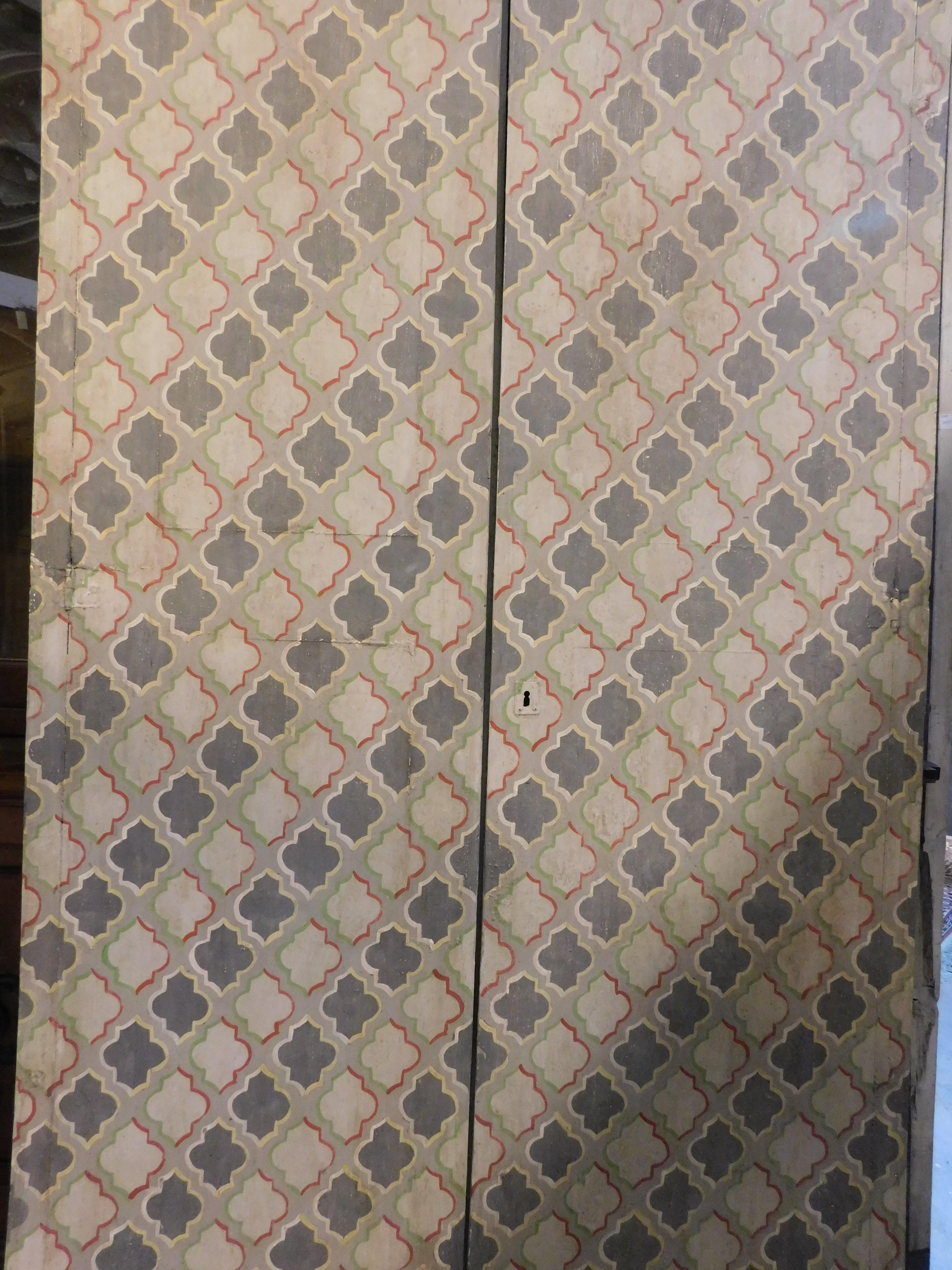 20th Century wall cabinet, double wing placard painted with geometric decorations, Italy