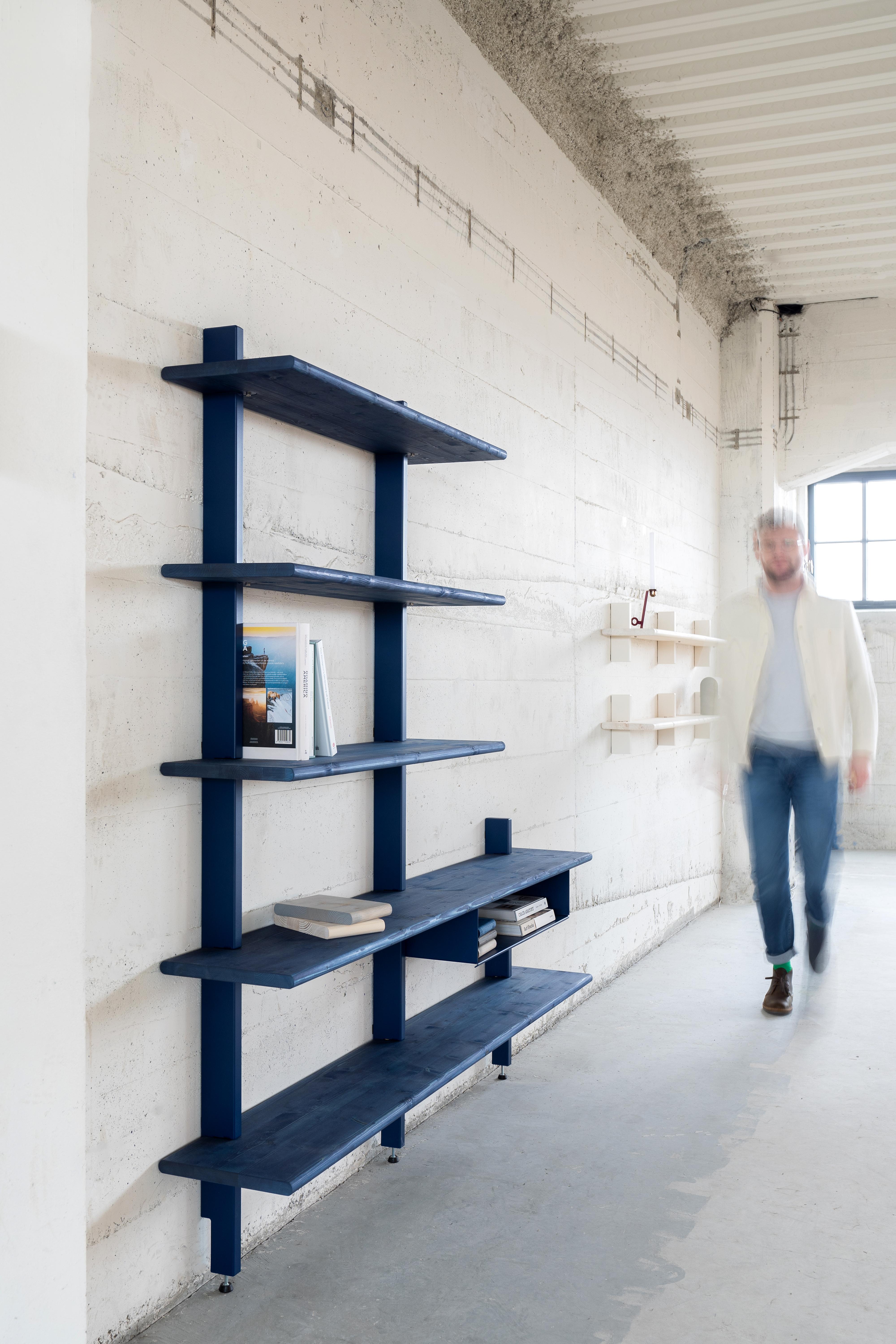 Pine consists - in addition to steel wall profiles - of pine shelves with a signature pattern and natural look. The new wall system offers endless possibilities; from a single wall shelf to a wall filling bookcase. 

The different parts are
