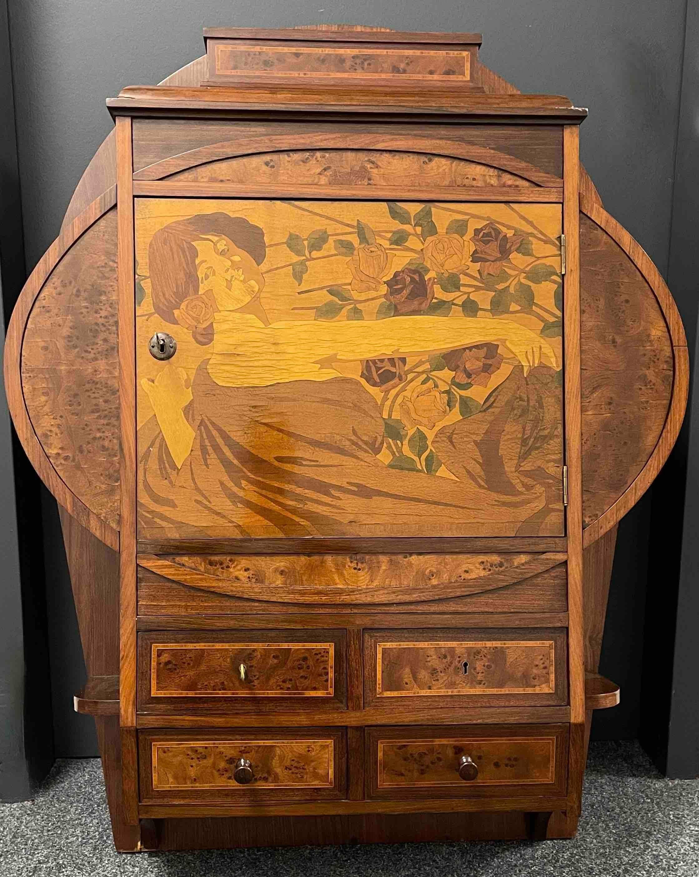 Beautiful wall cabinet with 4 drawers and marquetry inlay Door. Perfect as a furniture in your dressing room for your lingerie or in your living room. It could also be great at the wall as a Humidor for your Cigars. The piece is in very good antique