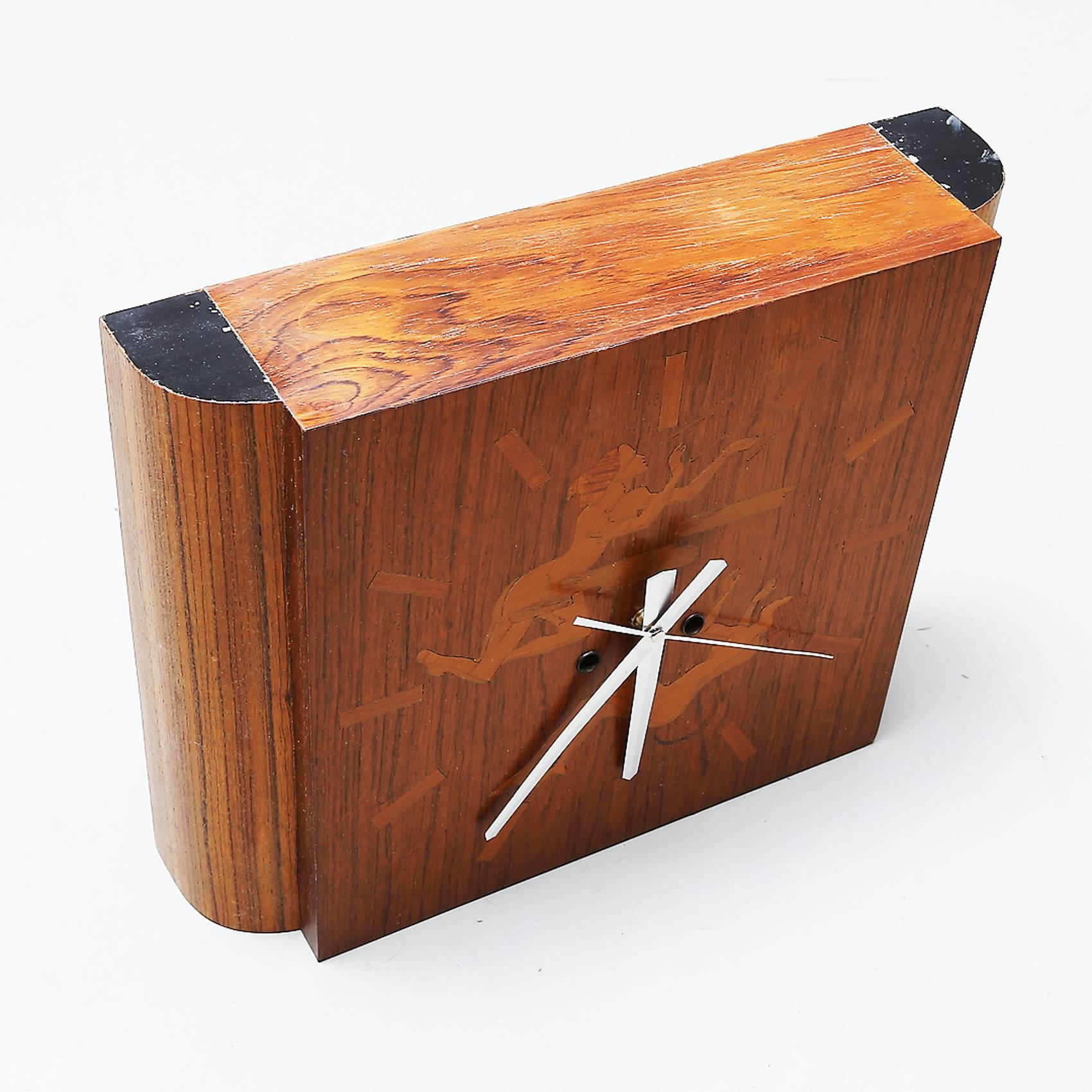 An original handcrafted inlaid Swedish wall clock attributed to Mjolby Intarsia. New battery movement.