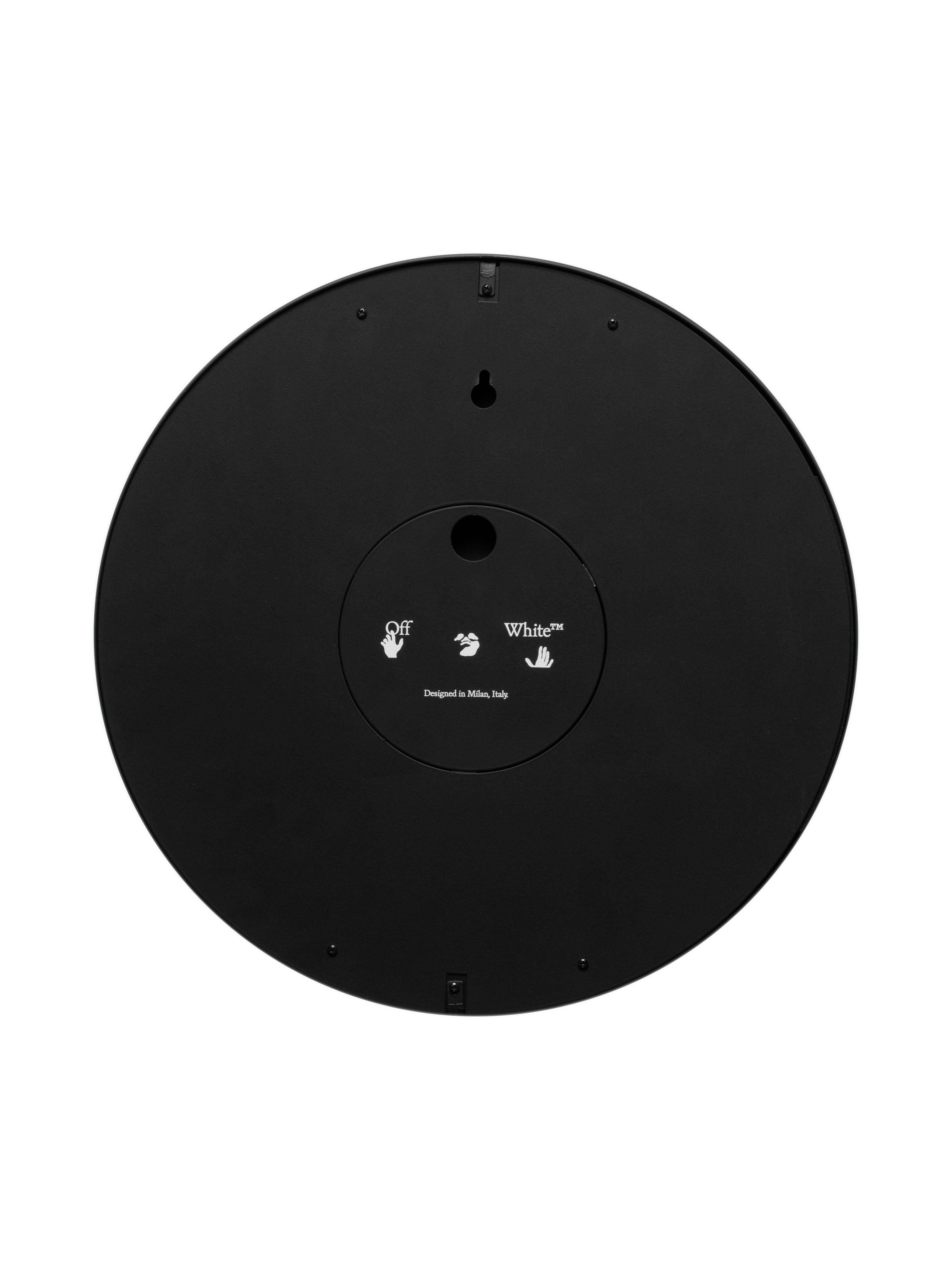 Round Wall Clock, Black metal and wooden structure with glass, Off-Hand logo in 12 o'clock position. Quartz movement, no batteries included.
By Virgil Abloh
Dimensions: 30 W x 4.8 H
This item is only available to be purchased and shipped to the