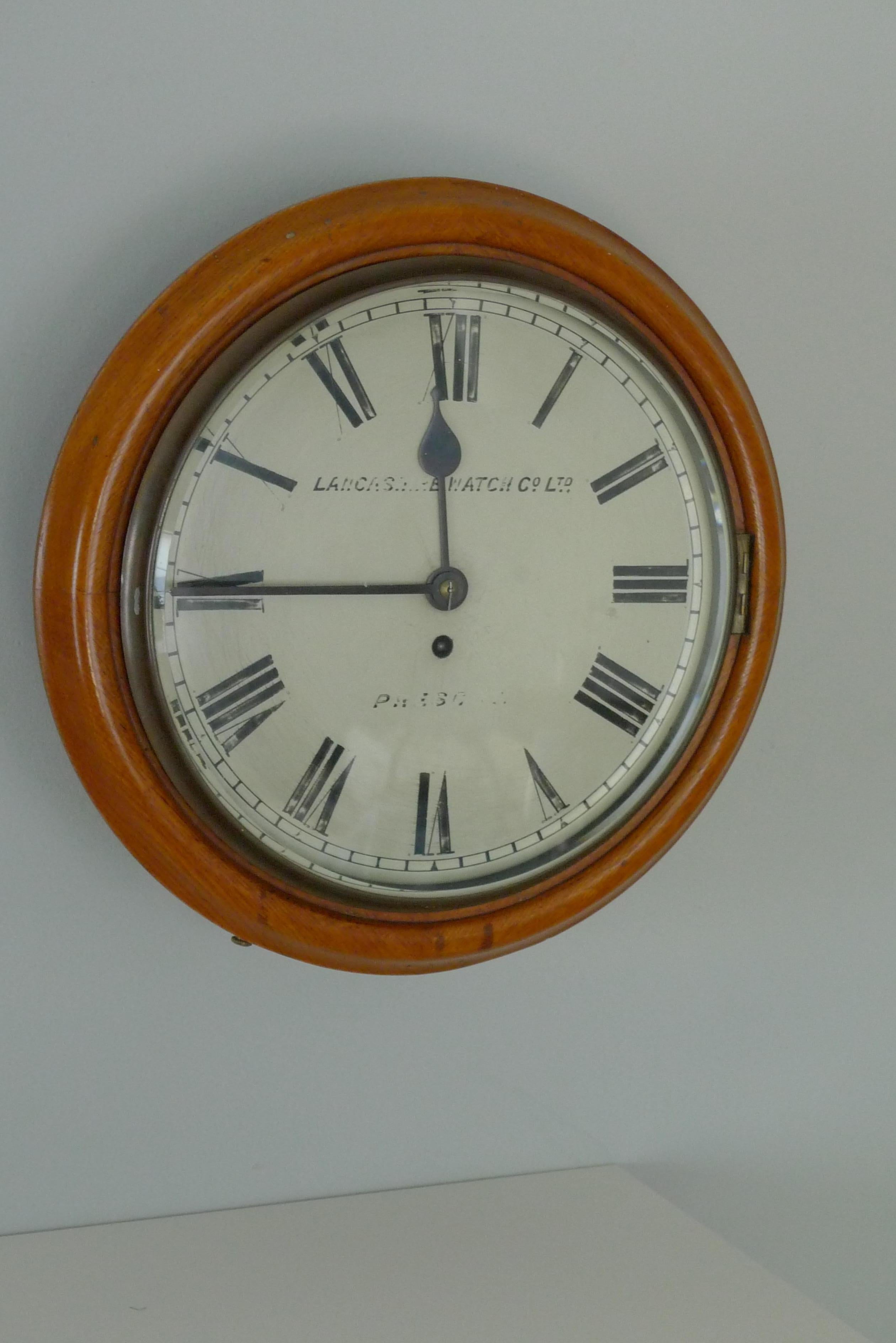 Brass Wall clock by Lancashire Watch Co. from rail station, late 19th cent. Ships free For Sale
