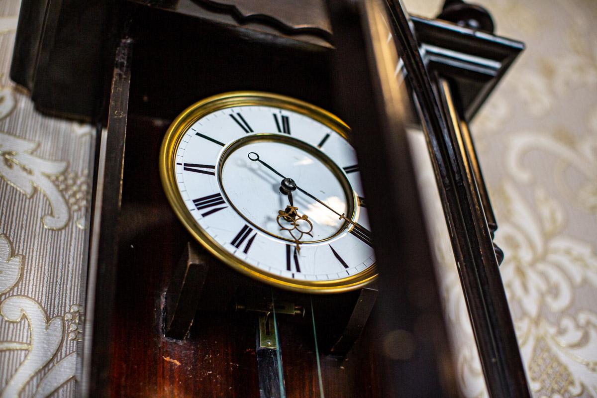 Brass Wall Clock from the Late 19th Century in Black Glazed Wooden Case For Sale