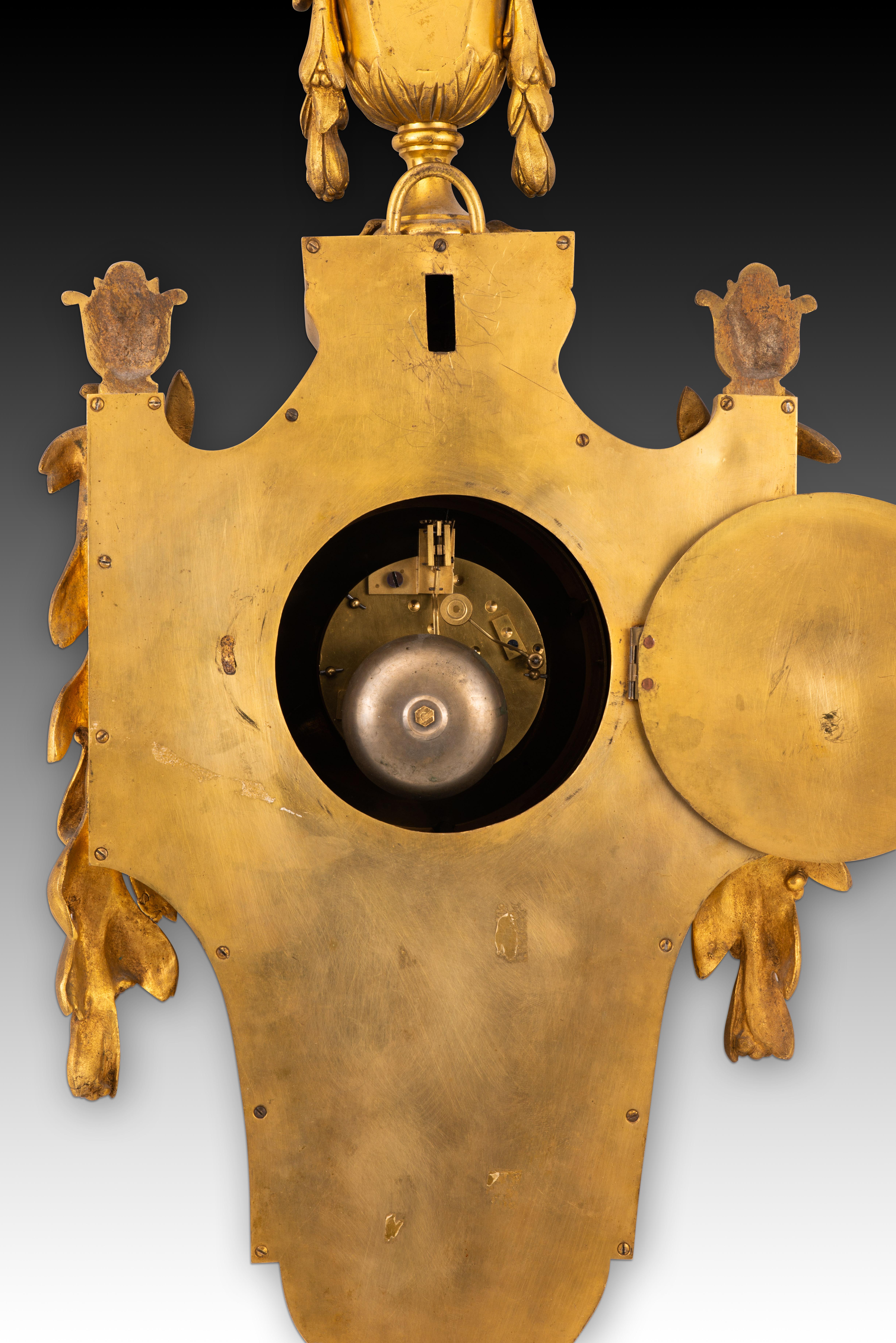 Bronze Wall clock. Gilt bronze. France, 19th century. For Sale