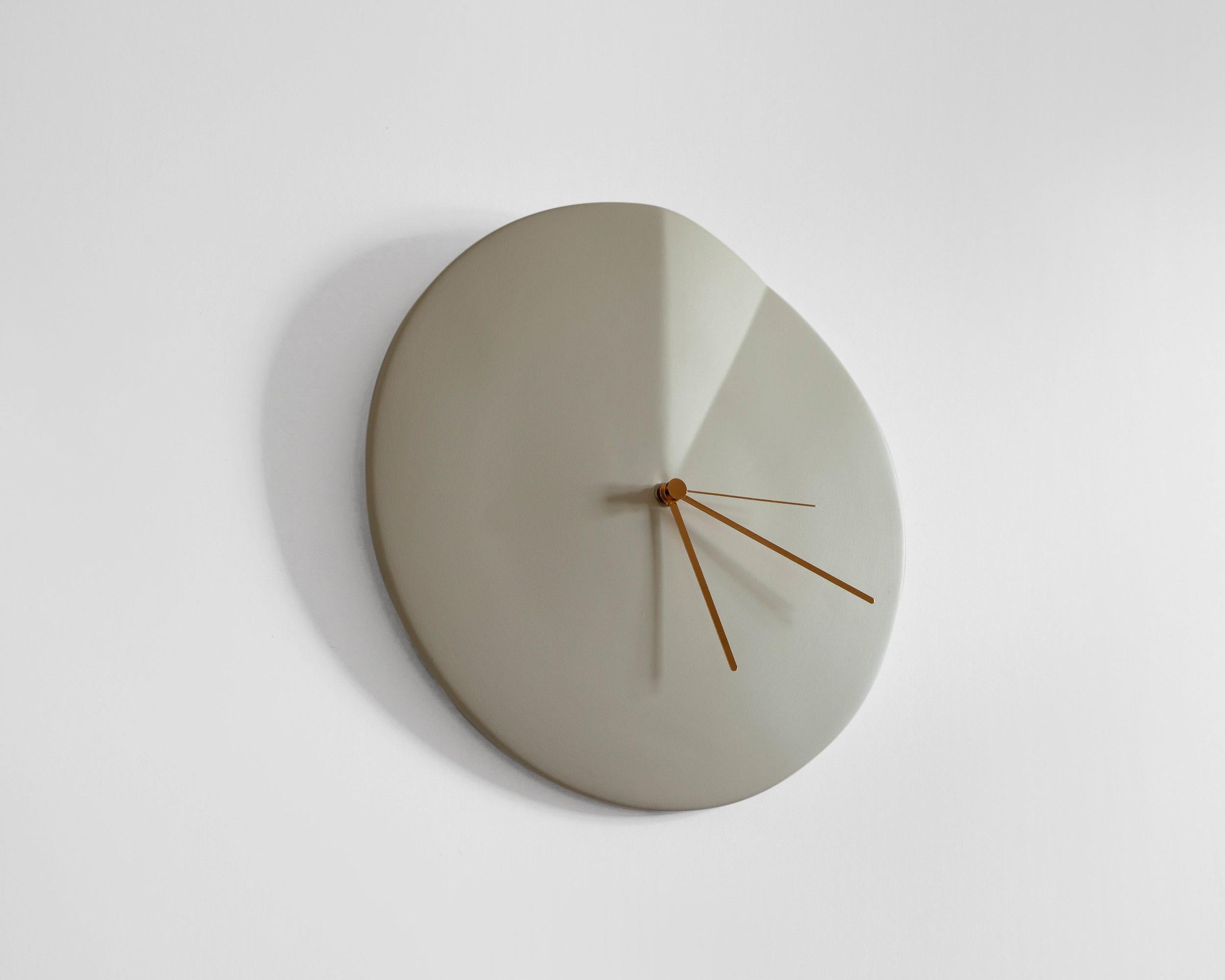 Oree
Wall clock signed by Ocrùm 

Dimensions: 11.75 x 1.5 in
Materials: Painted ceramic and aluminum hands
Colors: 
Cream White / Wine Red / Light Blue / Granite Blue / Light Grey / Antique Pink 
Hands: Copper / Grey
Movement:
Silent
