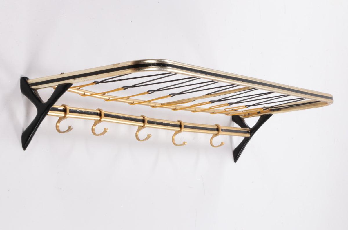 Wall Coat Rack Hollywood Regency Style, 1960s

Gold-colored aluminum coat rack from Germany.

There is an extra rack under the top rack.

Probably made in the 60s, now completely hip again.

Some discolouration in some places, which is not