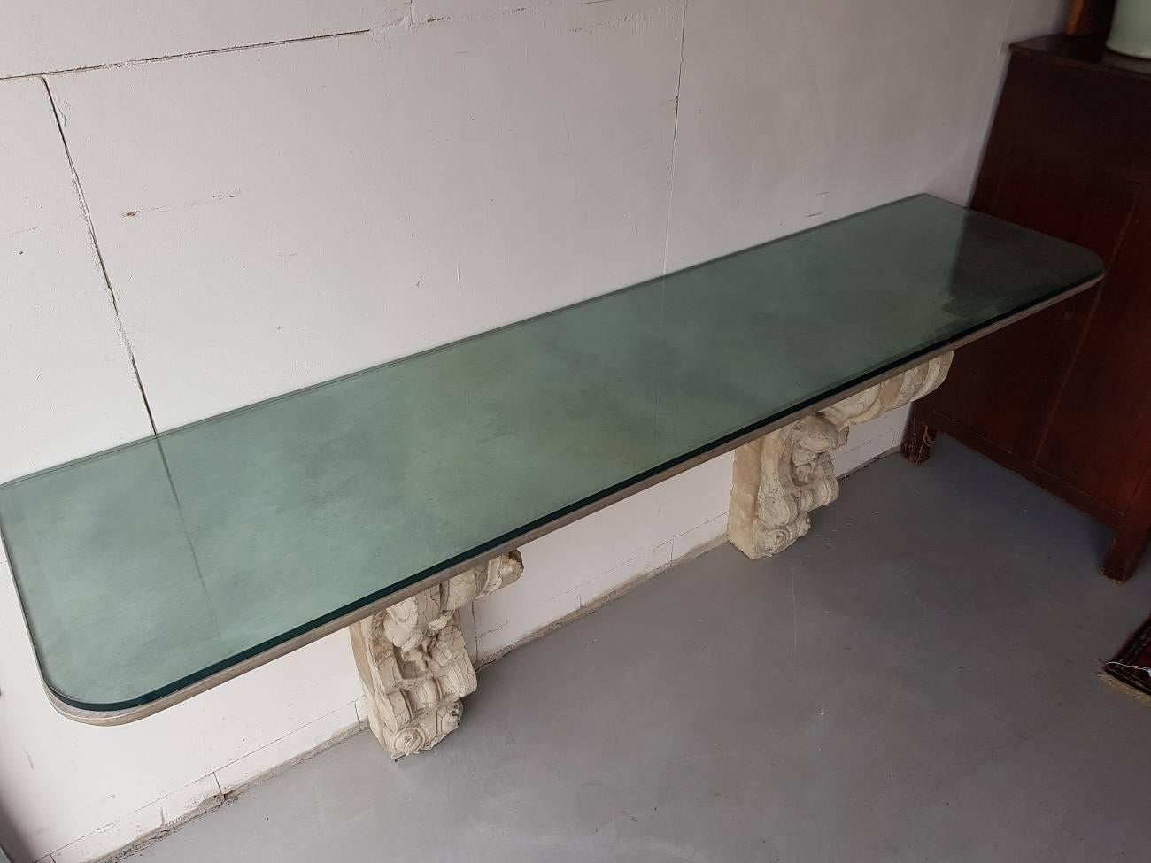 Wall console table with 18th century sandstone equipped with wooden sheet with grey marbled pattern, and if a thick top glass plate with faceted edge.

The measurements are,
Depth 50 cm/ 19.6 inch.
Width 207 cm/ 81.4 inch.
Height 89 cm/ 35
