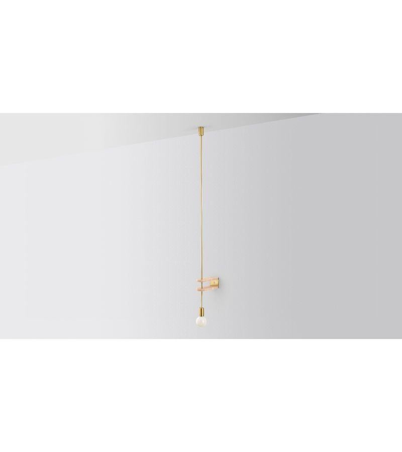 Wall Discus Light by Volker Haug
Dimensions: D 25 x W 9 x H 87 cm 
Material: Brass. Marble
Finish: Polished, Aged, Brushed, Bronzed, Blackened, or Plated
Marble Disc: As specified (shown in pink marble)
Lamp: Opal G95 LED (E26/E27 110 -