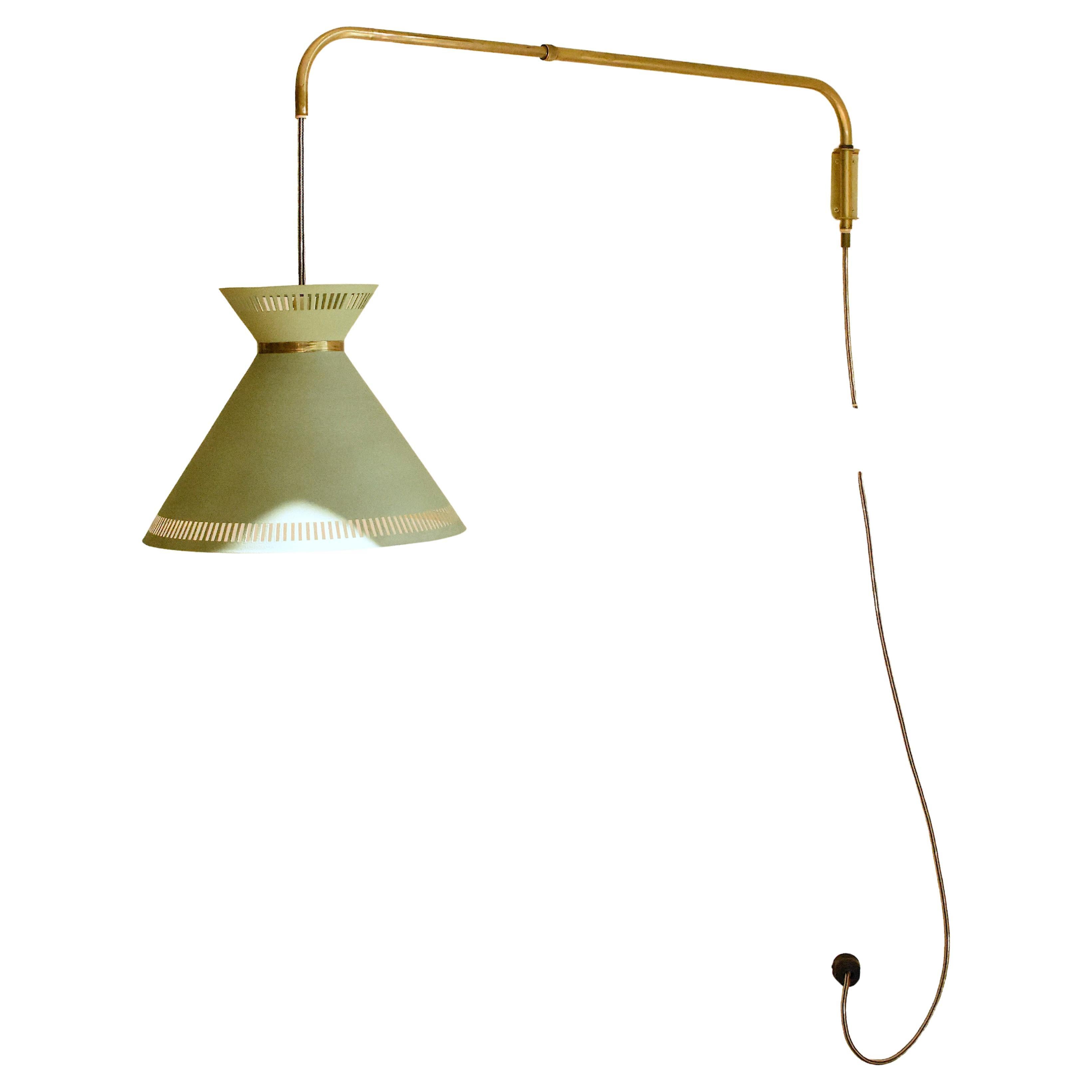 Wall extendable lamp
Sweden, 1960’s
Brass arm and green painted aluminum lampshade

Measurements
Arm length: 93 cm
Lampshade: 32 ⌀ cm x 26 (H) cm

Condition
Very good condition. Electrical system works.

Provenance
Private collection, Stockholm