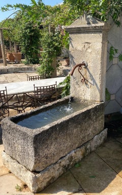 Wall fountain created from ancient  limestone elements