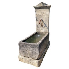 Wall fountain created from ancient  limestone elements