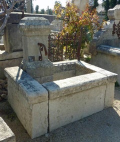 Wall Fountain of Provence in Patinated Natural Stone and Antique Wrought Iron
