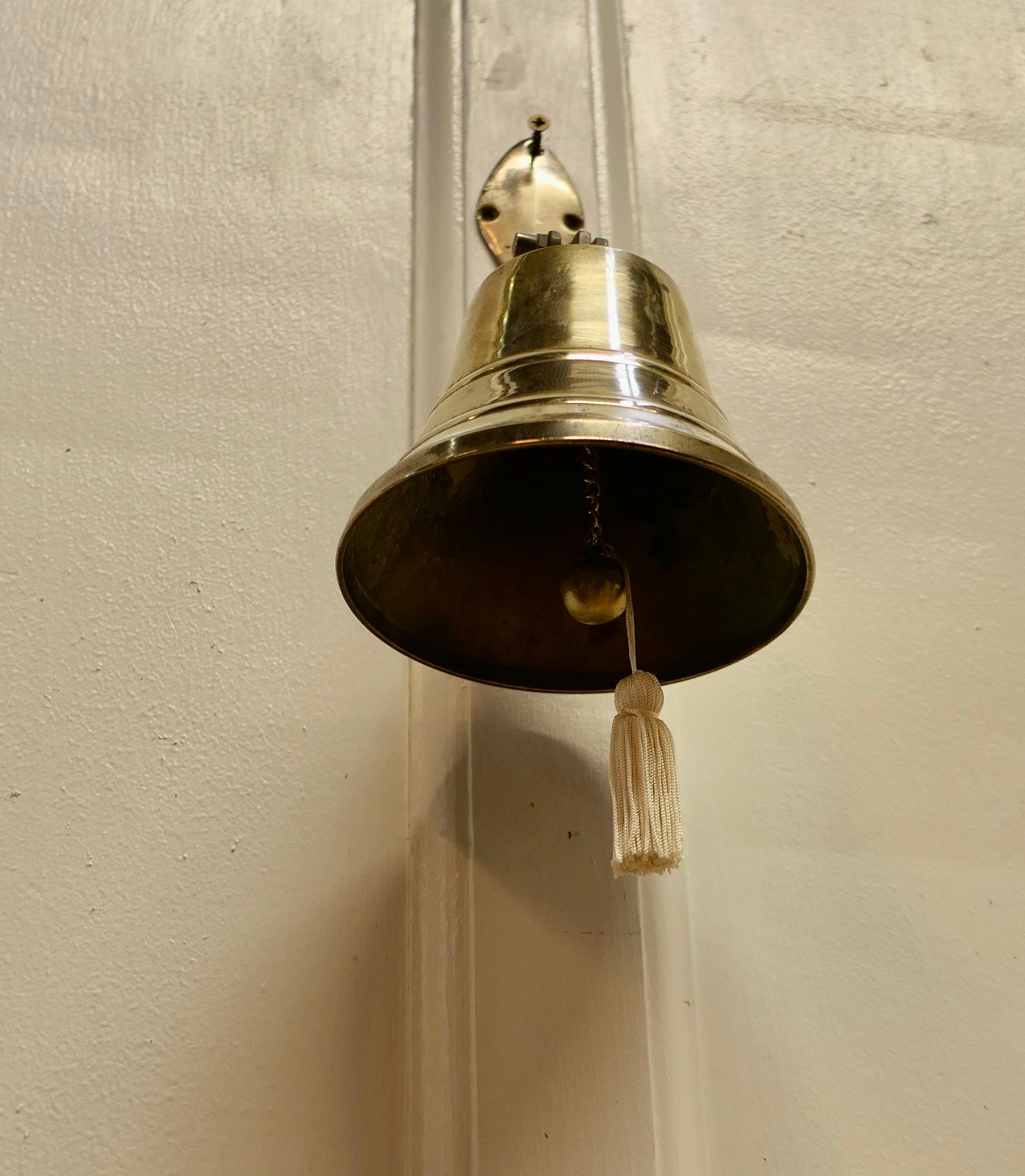 Wall hanging brass door bell.

This bell is on a hinged brass bracket and comes complete with hand clapper, it is in very good condition, it is very loud and would work well as a door bell 
A great piece in excellent condition.
The bell is 10”
