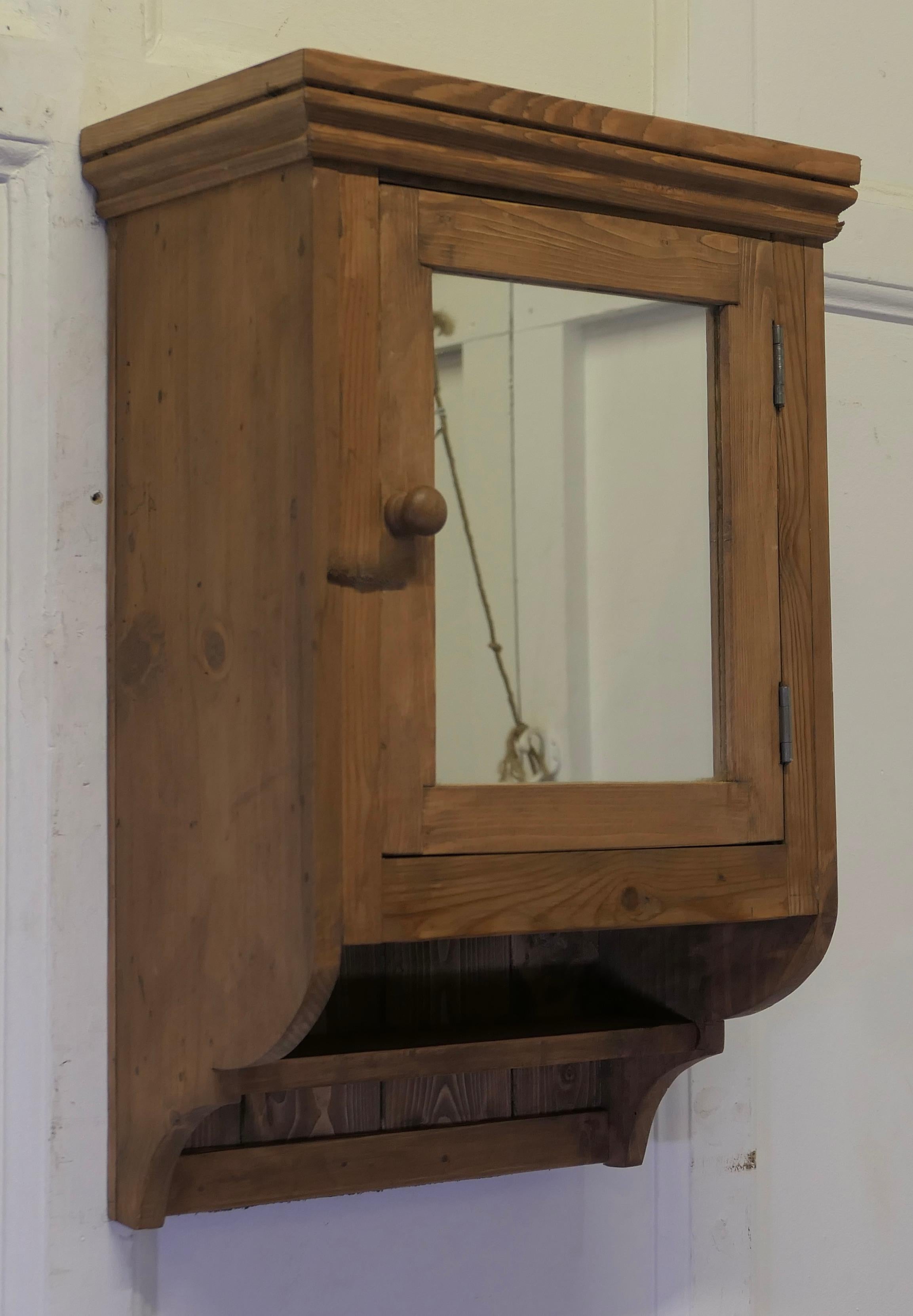 Wall Hanging Cloakroom or Bathroom Cupboard  

A very useful bathroom cabinet this wall hung shelved cupboard has mirrored door and a small shelf below 
It would work very well in a small Cloakroom where space is limited or in a traditional Bathroom