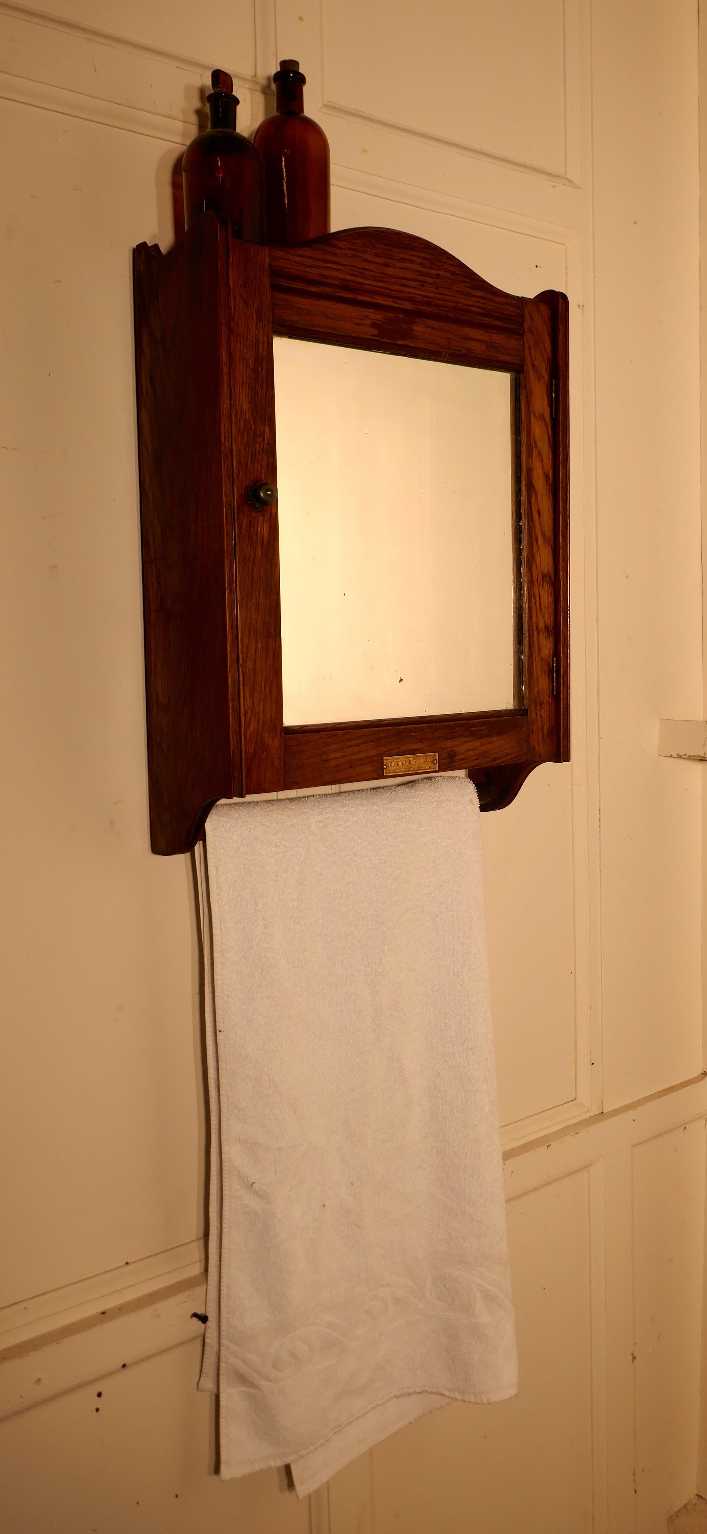 20th Century Wall Hanging Oak Cloakroom or Bathroom Cupboard from the Initial Towel Supply Co