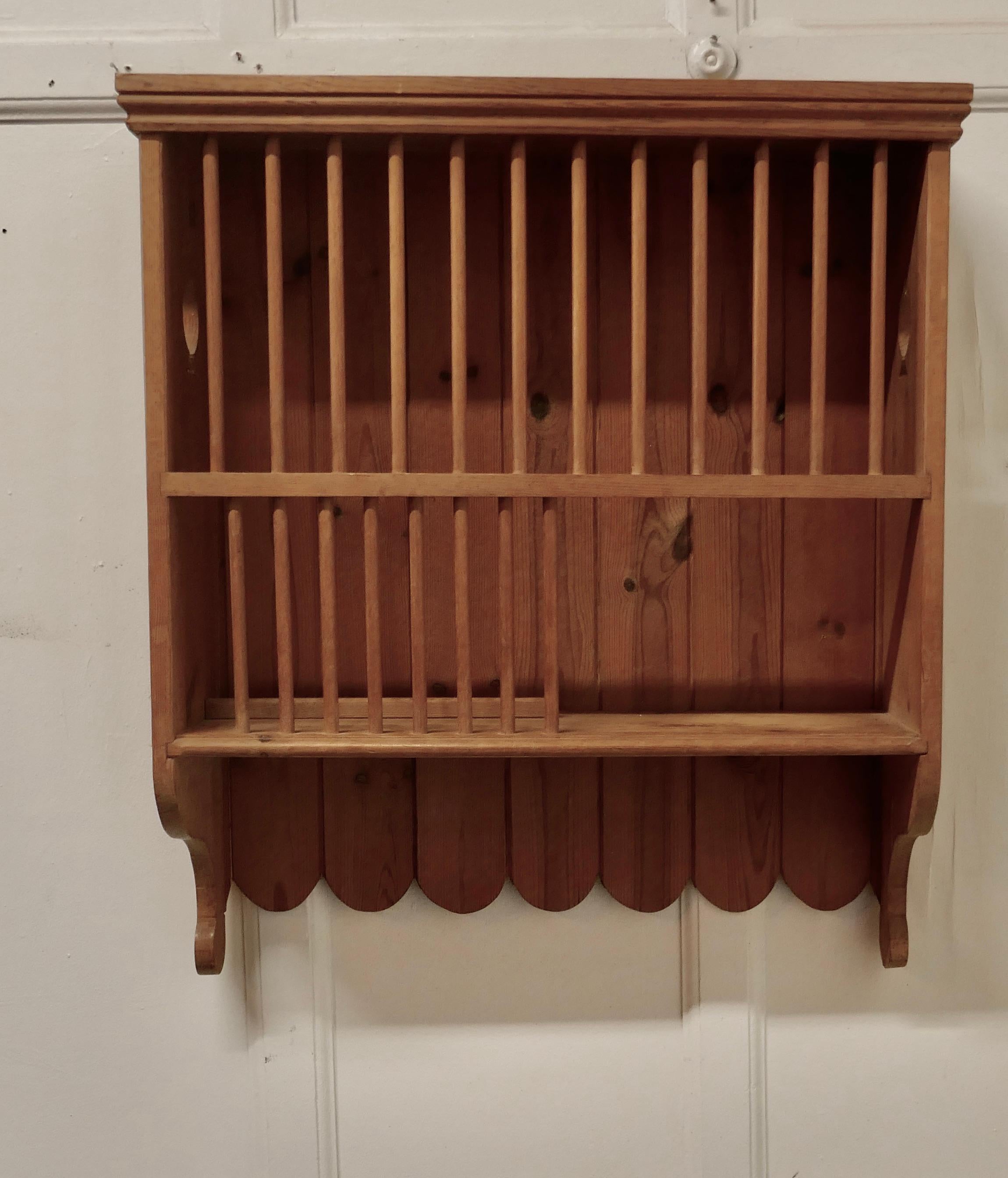 Wall hanging pine plate rack


This useful piece hangs on the wall and drains and stores plates until required, this one has a planked back and decorative holes on the sides.
It has a pine frame and wooden dowels with a waterfall shape, allowing