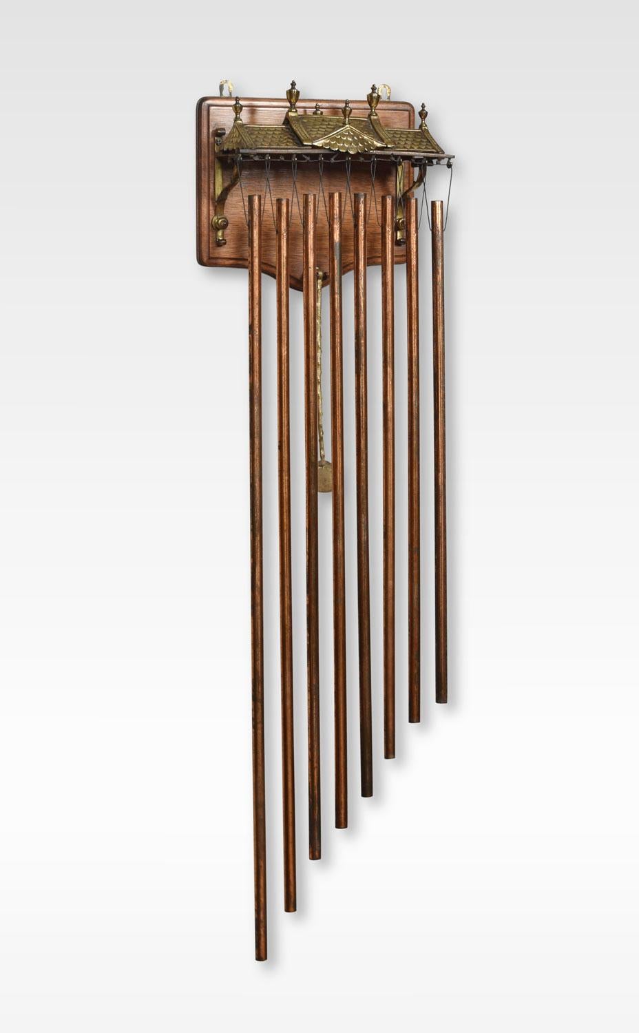An unusual wall hanging tubular dinner gong. The oak back plaque applied with a brass pagoda roof above eight hanging copper tubular chimes, together with original Hammer.
Dimensions:
Height 40.5 inches
Length 12 inches
Width 6 inches.