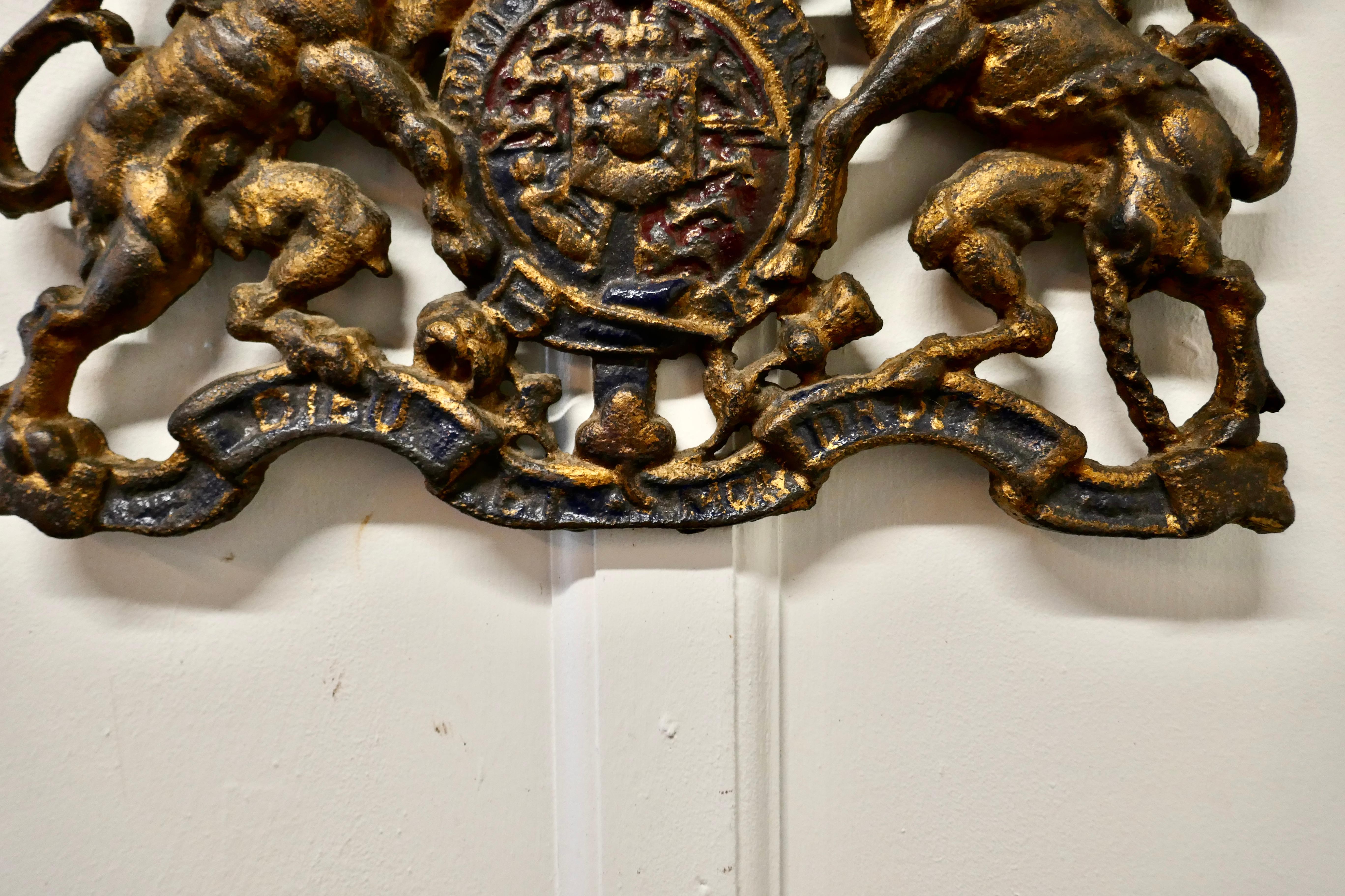Wall hanging Victorian cast iron royal coat of arms shield plaque 

Needless to say this charming wall plaque is a very heavy piece, it was originally wall hung and has a painted finish, some of which has worn away but it still shows its majestic