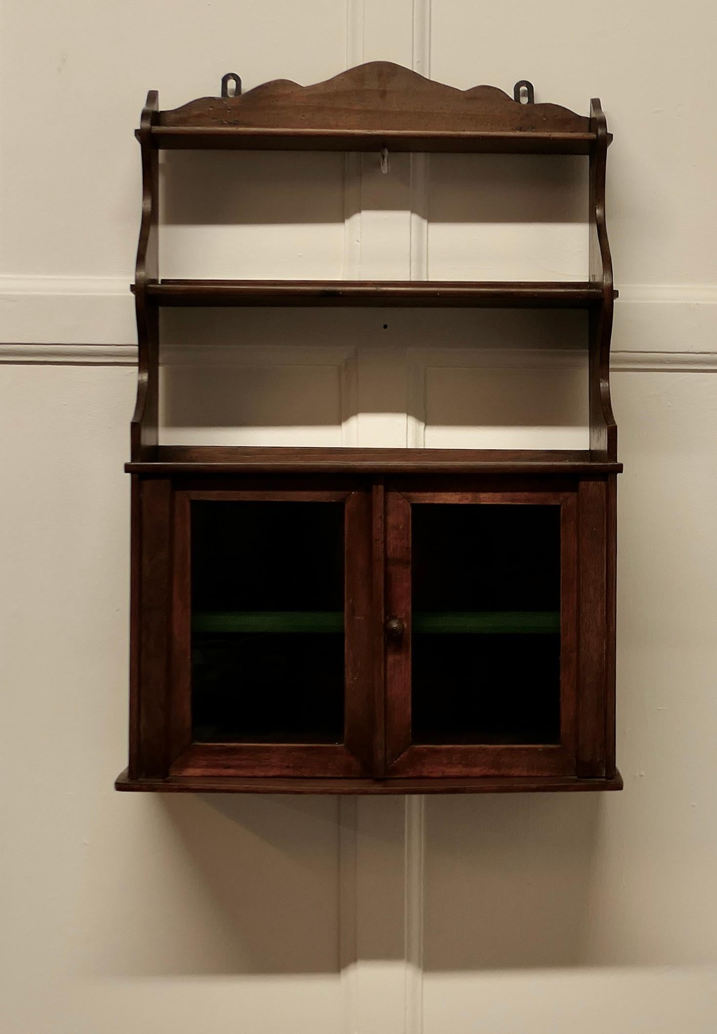 Wall Hanging Walnut Cloakroom or Bathroom Cupboard 

A very useful bathroom cabinet the cupboard has two glazed doors enclosing a shelf and 2 shelves above
It would work very well in a small Cloakroom where space is limited or a traditionally