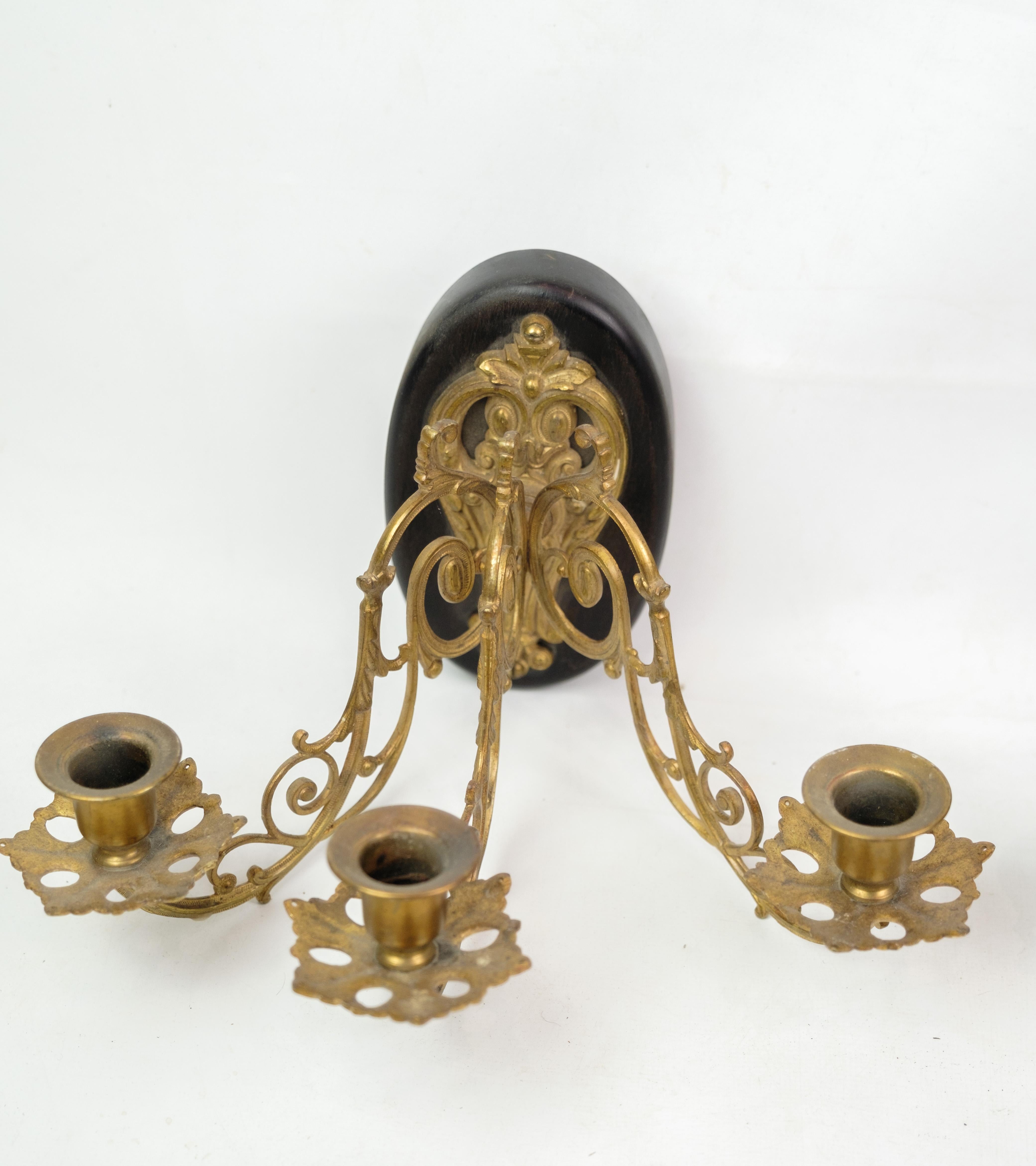 Experience an antique atmosphere with this pair of French bronze wall sconces from the 1930s. These wall sconces are more than just lighting fixtures; they are timeless works of art that bring the charm of a bygone era into your home.

The bronze