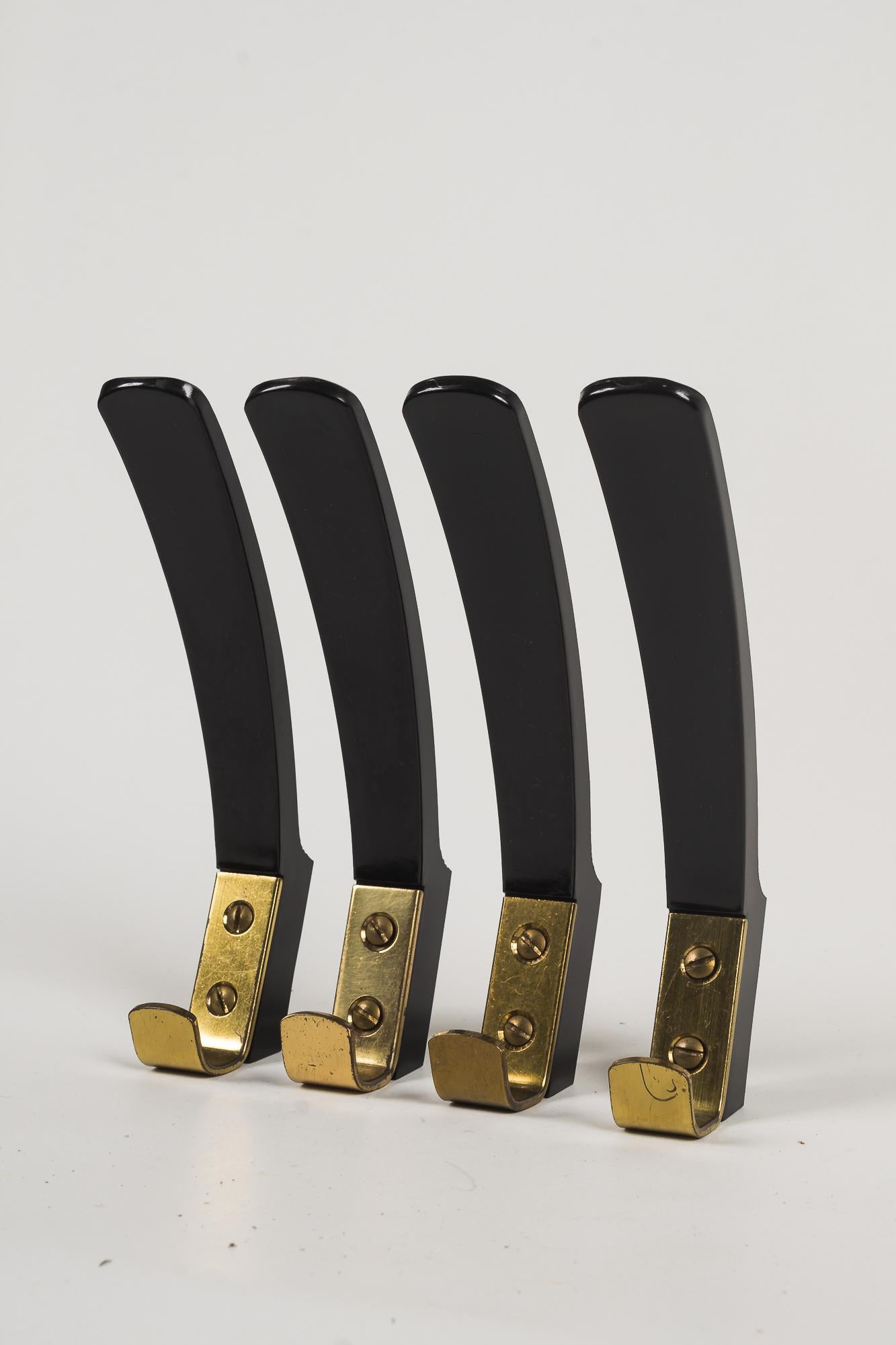 Mid-20th Century Wall Hooks 'Bakelite and Brass', Vienna, circa 1950s For Sale
