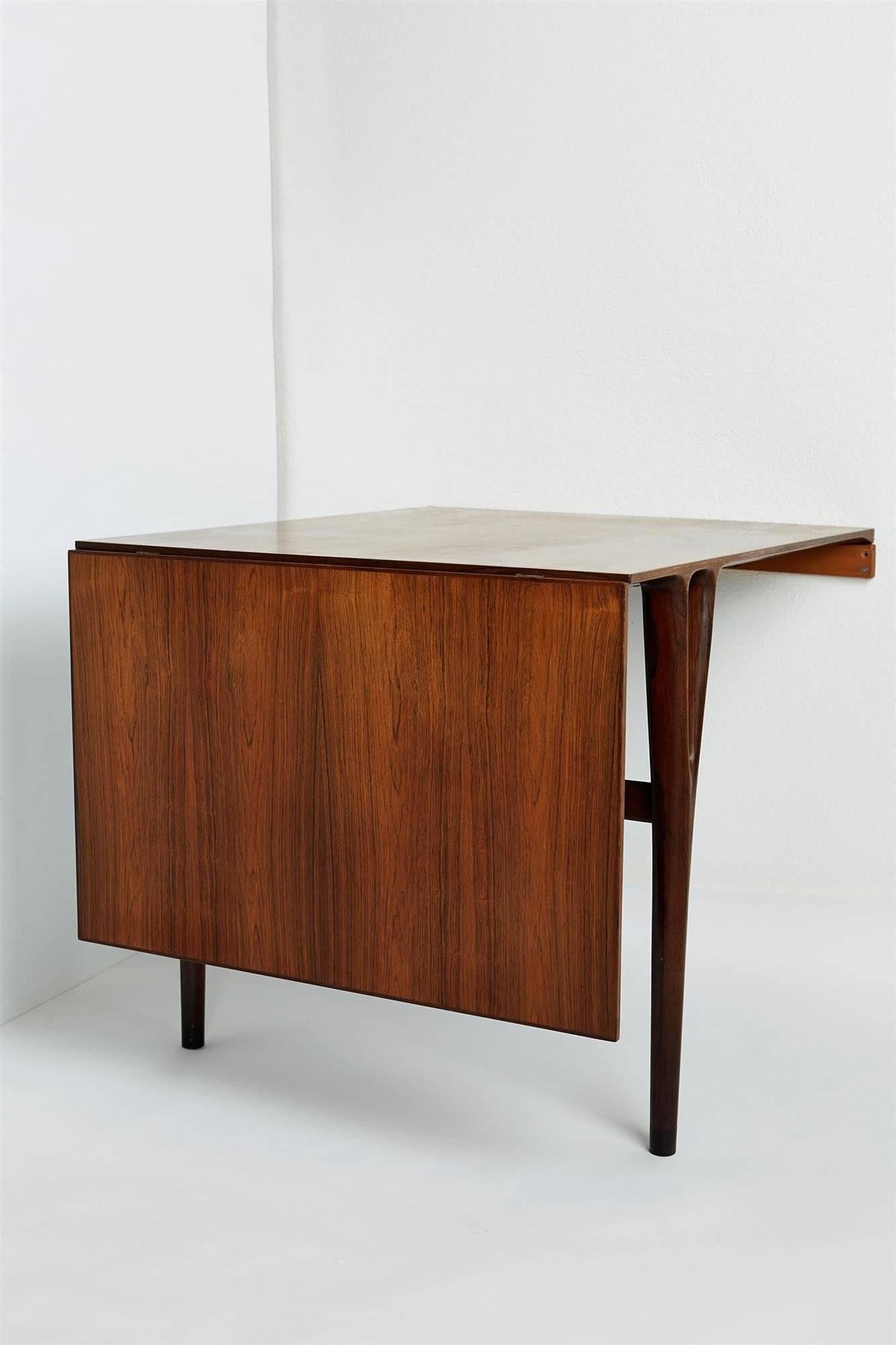 Wall hung table designed by Helge Vestergaard Jensen, for Peder Pedersen,
Denmark. 1950's.

Brazilian rosewood.

Dimensions:
H: 73 cm/ 28 3/4''
L: 90 cm/ 35 1/2''
Length when fully extended: 141 cm/ 4' 7 1/2''
D: 77 cm/ 30 1/2''