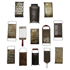 Thirteen Antique Metal Kitchen Graters: Wall Decor from 1930