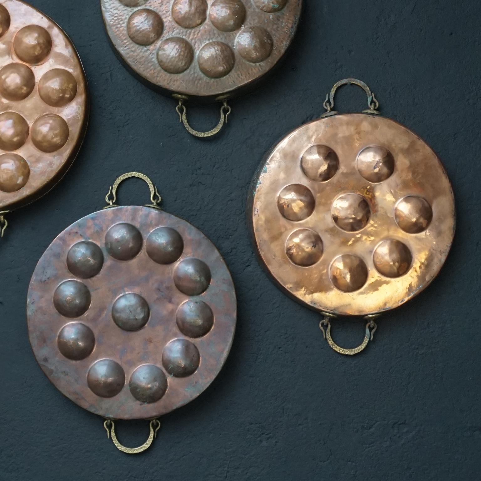 Brass Wall Kitchen Collection of Eight 19th Century French Copper Egg Poacher Pans