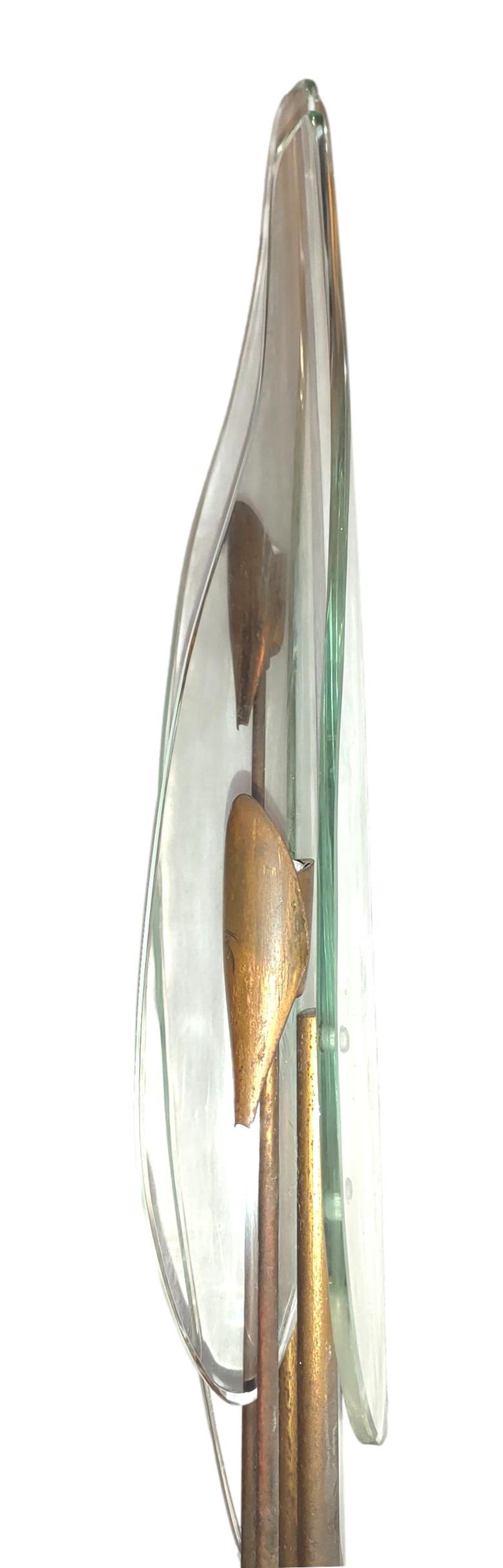 Wonderful 1461 model wall lamp, designed by max ingrand for Fontana Arte, in Italy, circa 1950.
Made of brass with double transparent Murano glass with green reflections. 
It measures 75 centimeters in height, in very good conservation conditions,