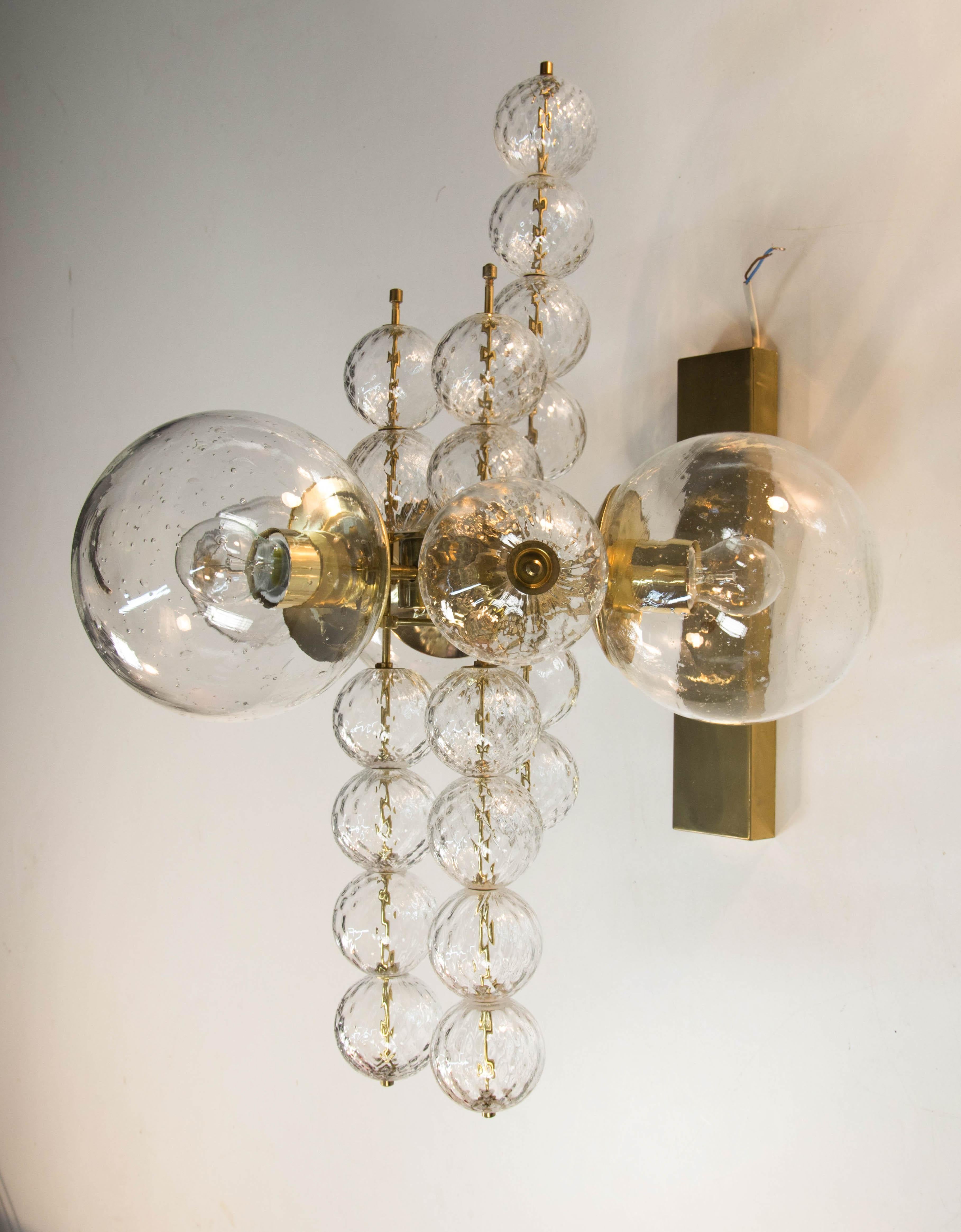 Luxury wall light fixture by Preciosa, Kamenicky Senov, Czechoslovakia.
Item consists of brass construction, 3 big glass globes (8