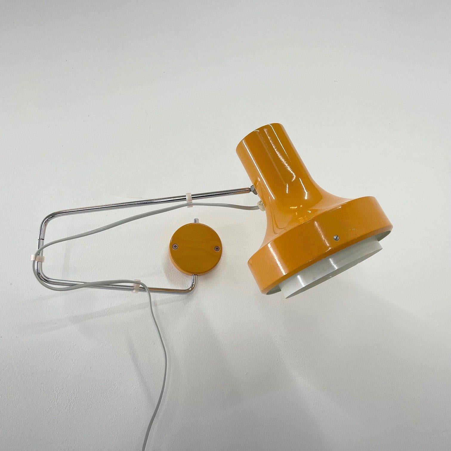 Orange adjustable wall lamp designed by Josef Hurka for Napako in former Czechoslovakia in the 1960's. 
Bulb: 1 x E25-E27.