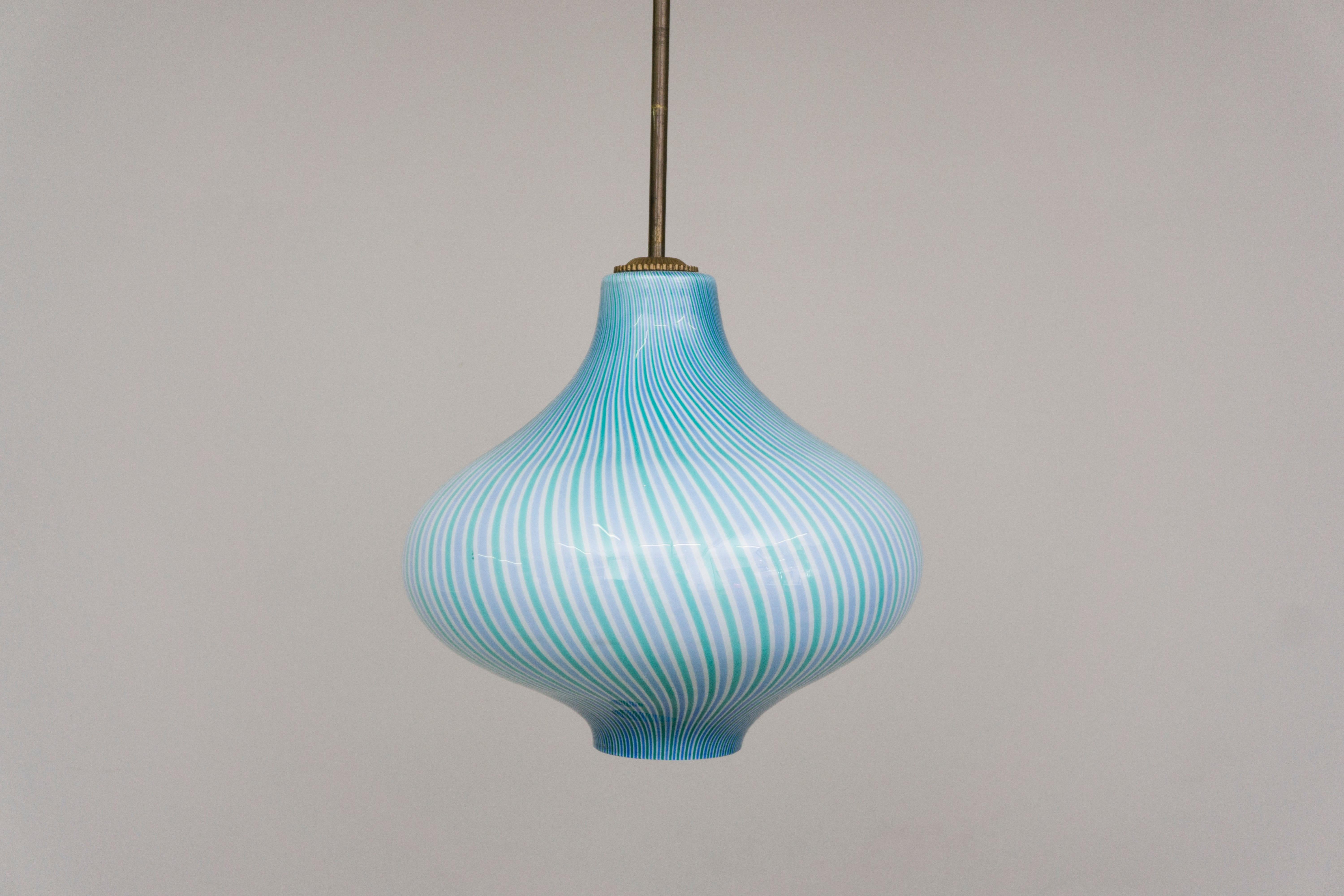 This bounteous pendant made of Murano glass has a unique flashed glass in a coloring in green and light blue which crate a beautiful glow when lit. The detailed yet minimal mounting is made of brass. Designed by Massimo Vignelli

Massimo Vignelli