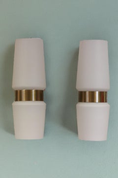 Wall lamp from the 1960s in opal glass and brass.
