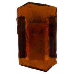 Wall lamp in amber colored mouth-blown art glass and brass. Italian design