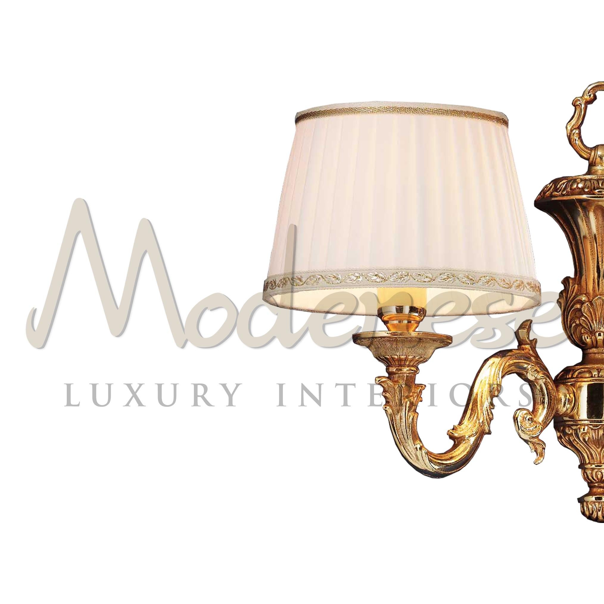 Complete a lavish social room with a baroque touch by adding this Modenese Interiors wall lamp. The iteam features two carved arms and their related ivory lampshades, plus a french gold finishing. The two lampbulbs must be E14 and maximum 40Watt.