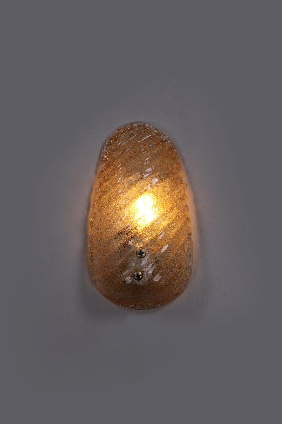 Wall lamp Model Shell Barovier & Toso, 1960, Italy

Vintage design gilded glass wall lamp from the 1960s. 
We attribute this wall lamp to Barovier because the glassware is truly characteristic of the brand. 
It is of very good quality and offers