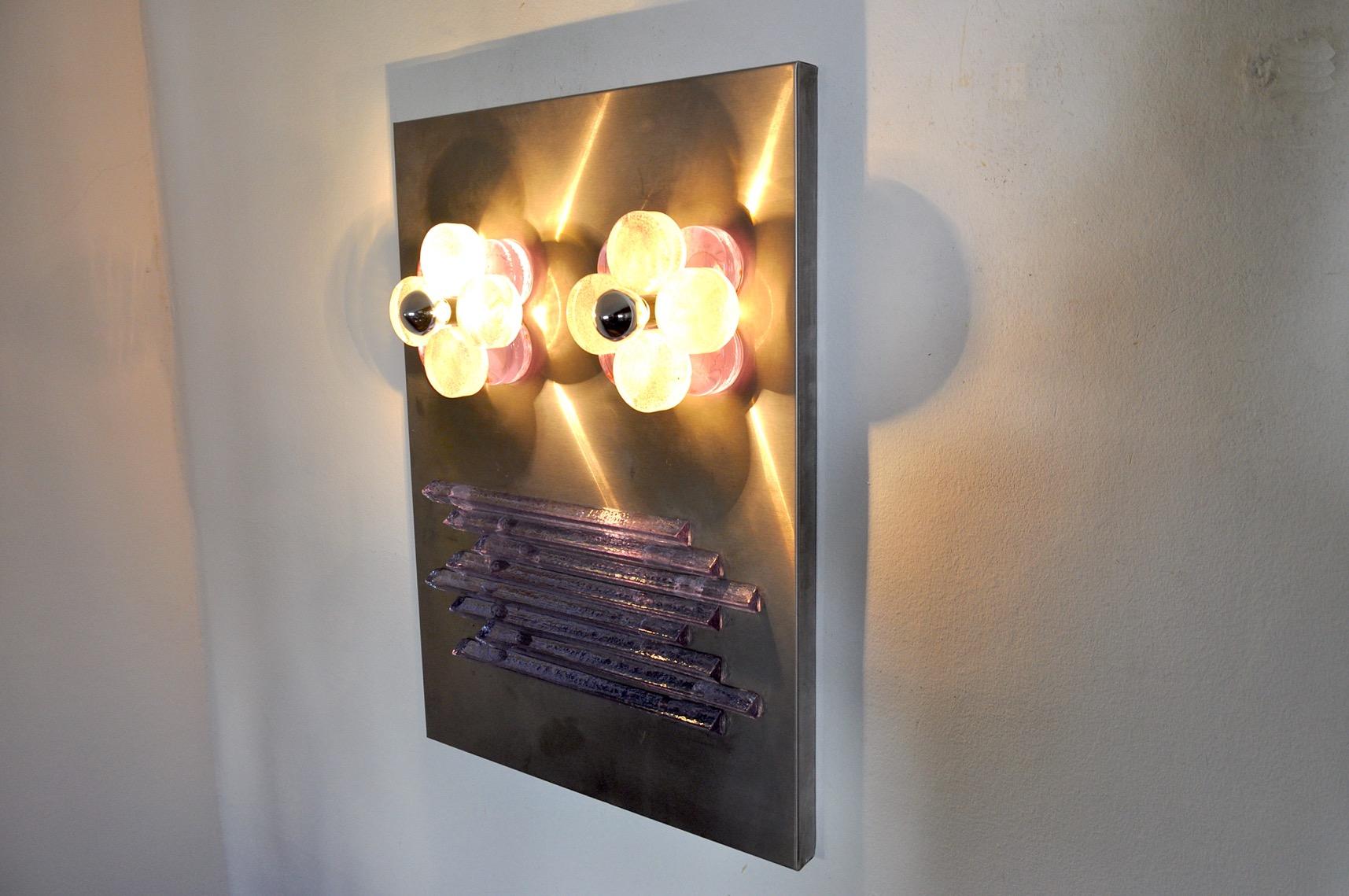 Rare xxl wall lamp by Albano Poli for Poliarte.
Designed and produced in Italy in the 1970s.
This panel is to be appreciated as a work of art, it is composed of purple glass bars mounted symmetrically and two points of light mounted on two round