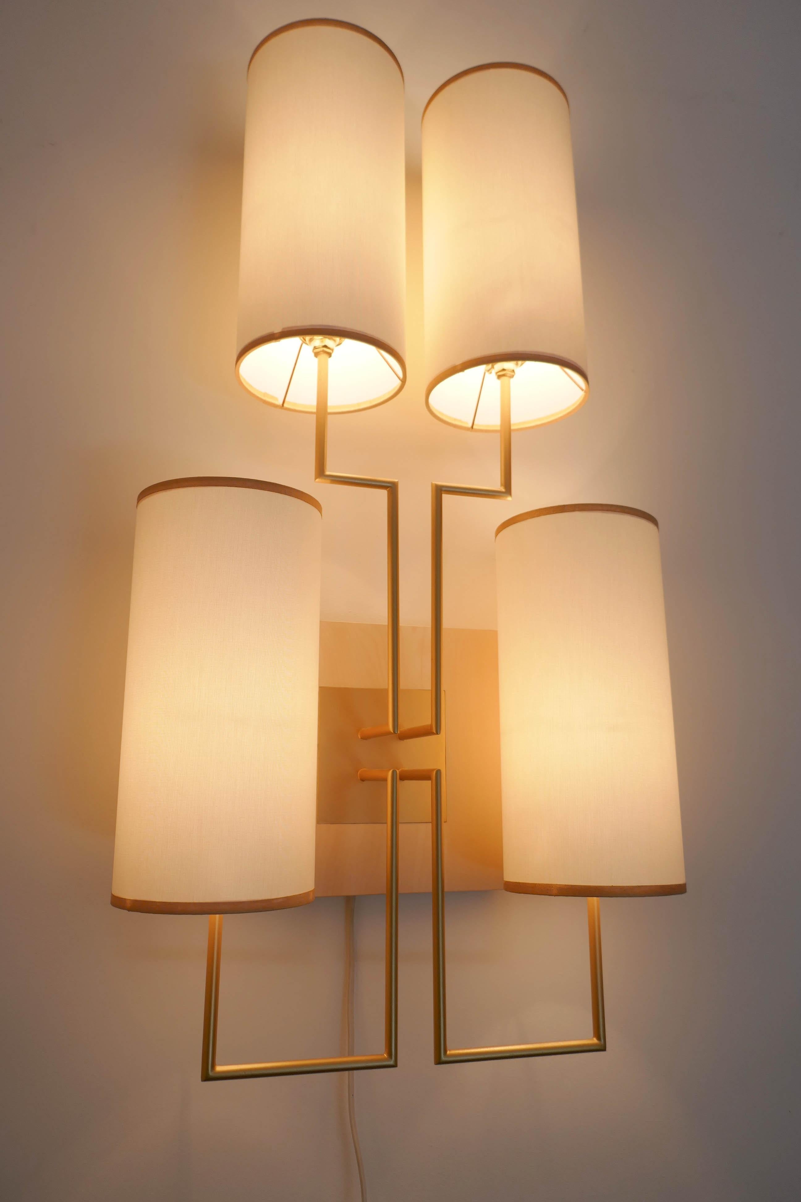 International Style Wall Lamp Sconce in Gold Patina and White Lamp Shades For Sale