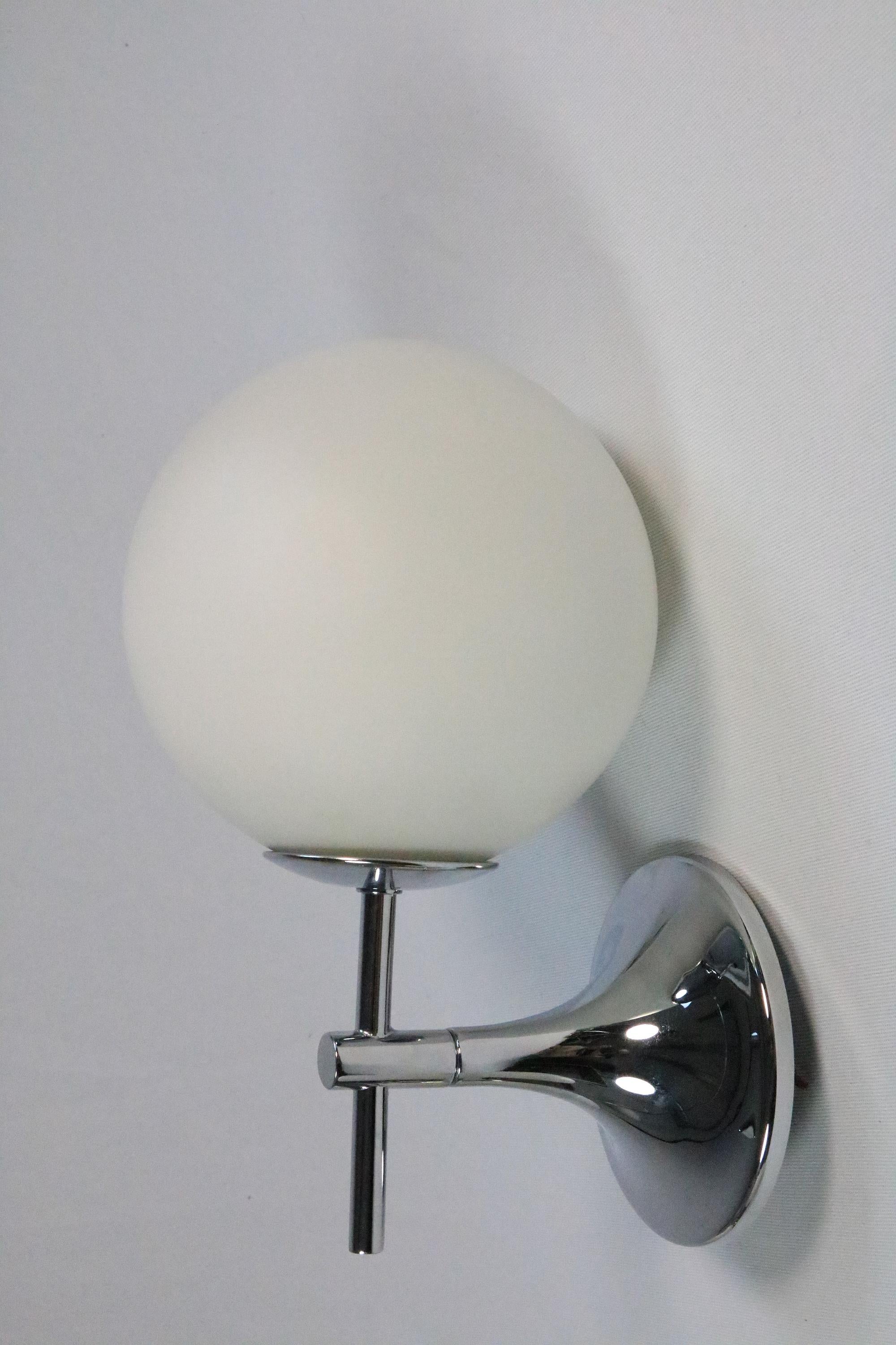 Very elegant single wall lamp with opal glass ball and chrome frame.

Manufacturer: Temde, Switzerland
Designer: E.R. Nele

The frame has a classic tulip shape.
There is a pair of almost identical lamps by Temde in brass. If you would like to