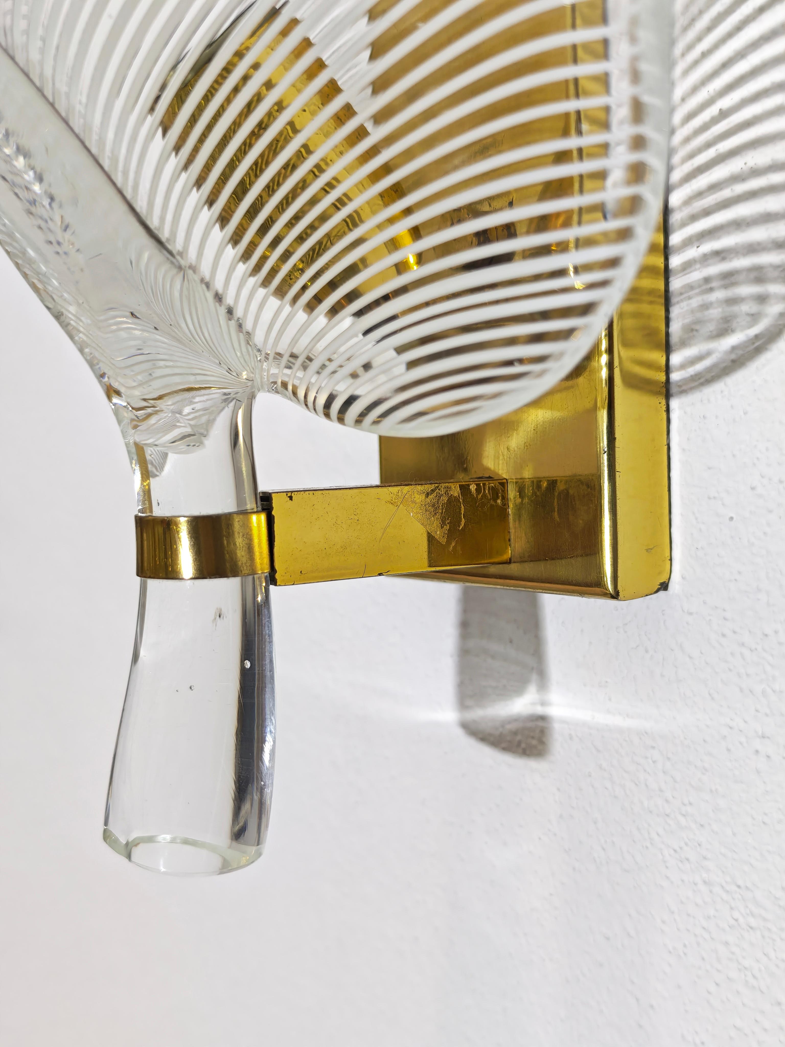 Mid-Century moderno Wall lamp with brass frame and half-filigree blown glass leaf Franco Luce 70s in vendita