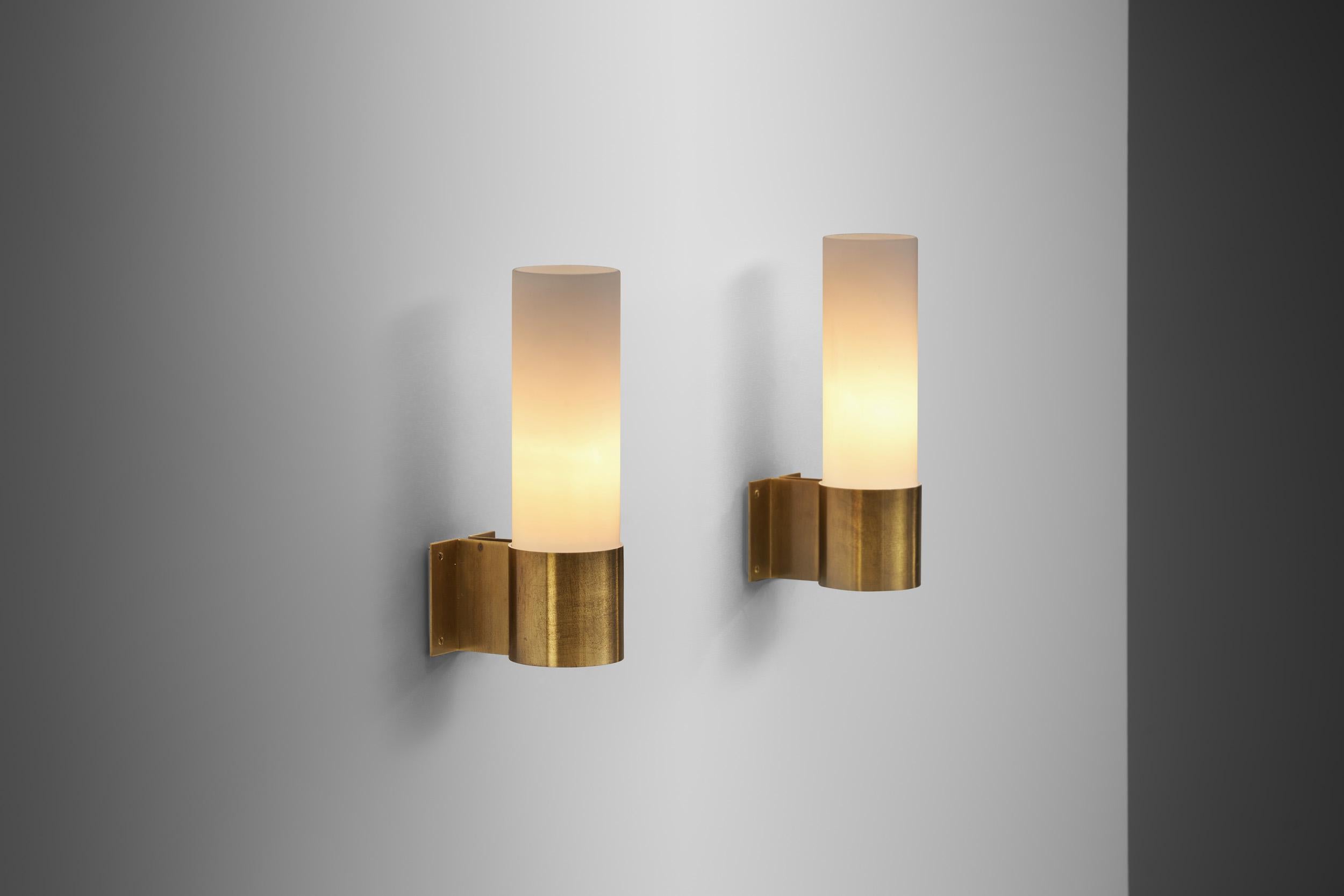 This pair of wall lamps of Fog & Mørup production were designed by architect and designer Professor Jørgen Bo. Like the architect/designer’s other creations, these wall sconces are brilliant in their simplicity, true timeless pieces.

Dating from