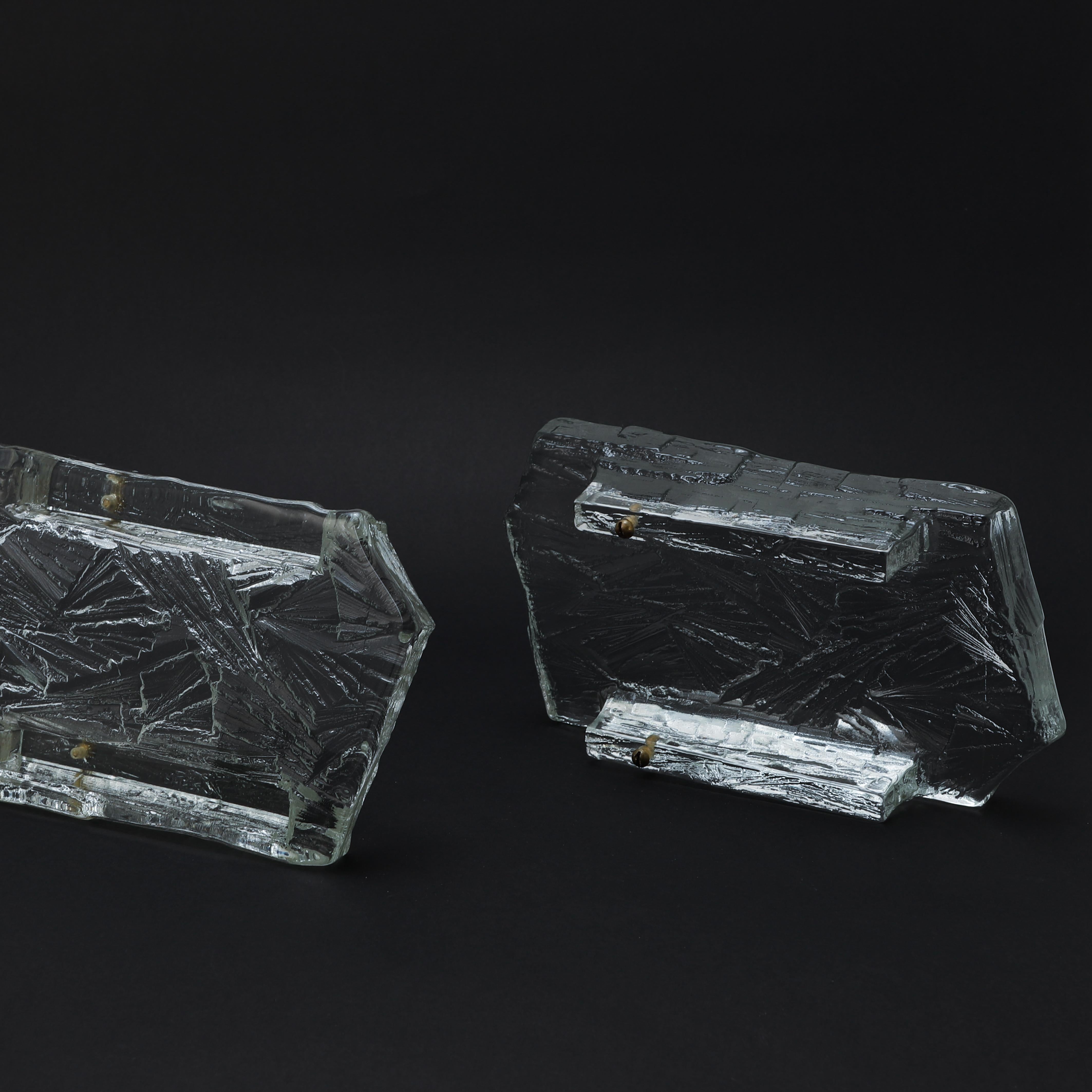 A pair of Thick molded glass wall lamps, marked NAFA 484, made in Sweden by
Nybro Armaturfabrik around 1960s.
Good condition
Price for the pair