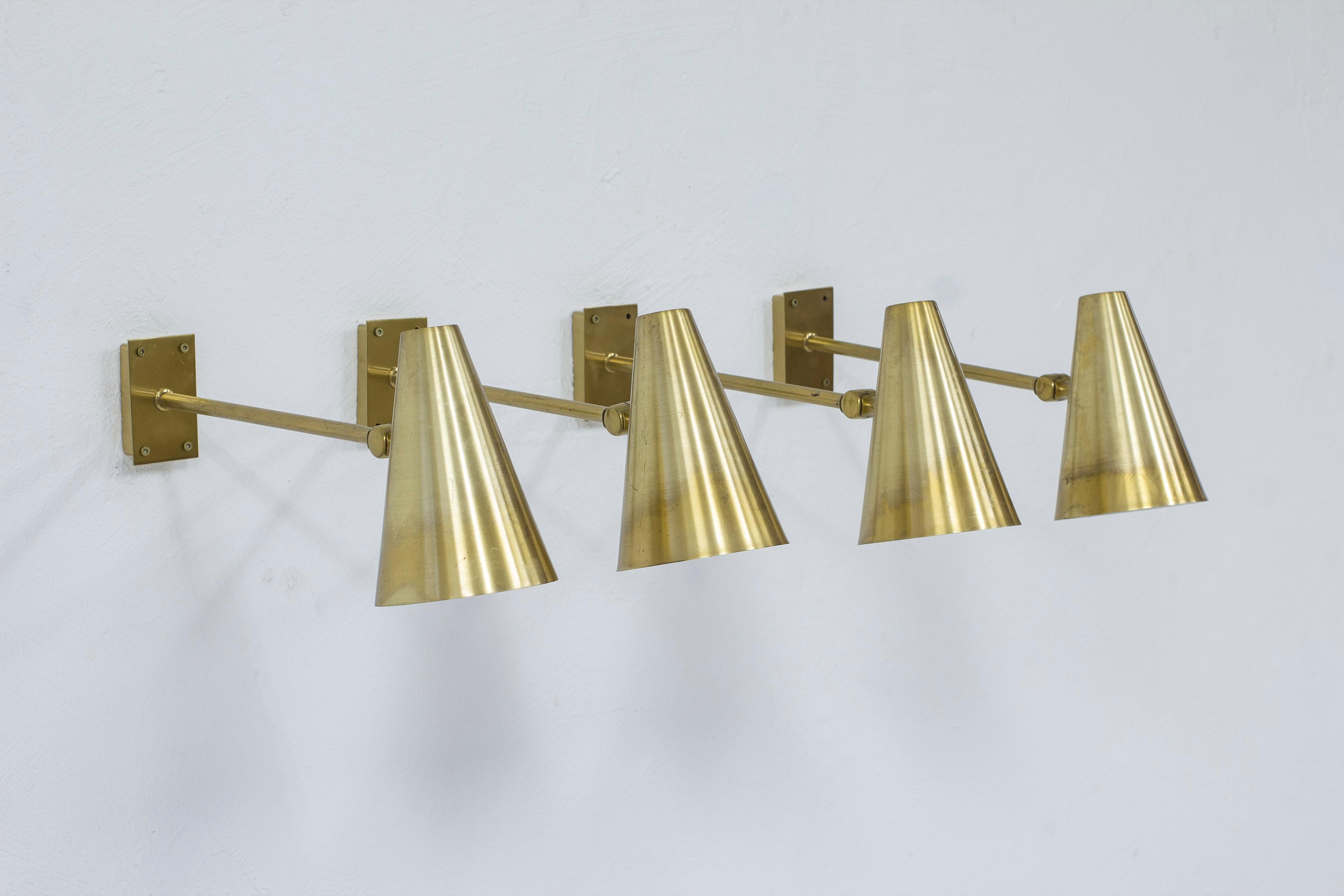 Wall lamps model 6255 produced by Falkenbergs belysning. Made in Sweden ca 1950-60s. Matte polished solid brass. Adjustable in angle. Good vintage condition with age related wear and patina.

 

Price per lamp. Four lamps available.



Designer:
