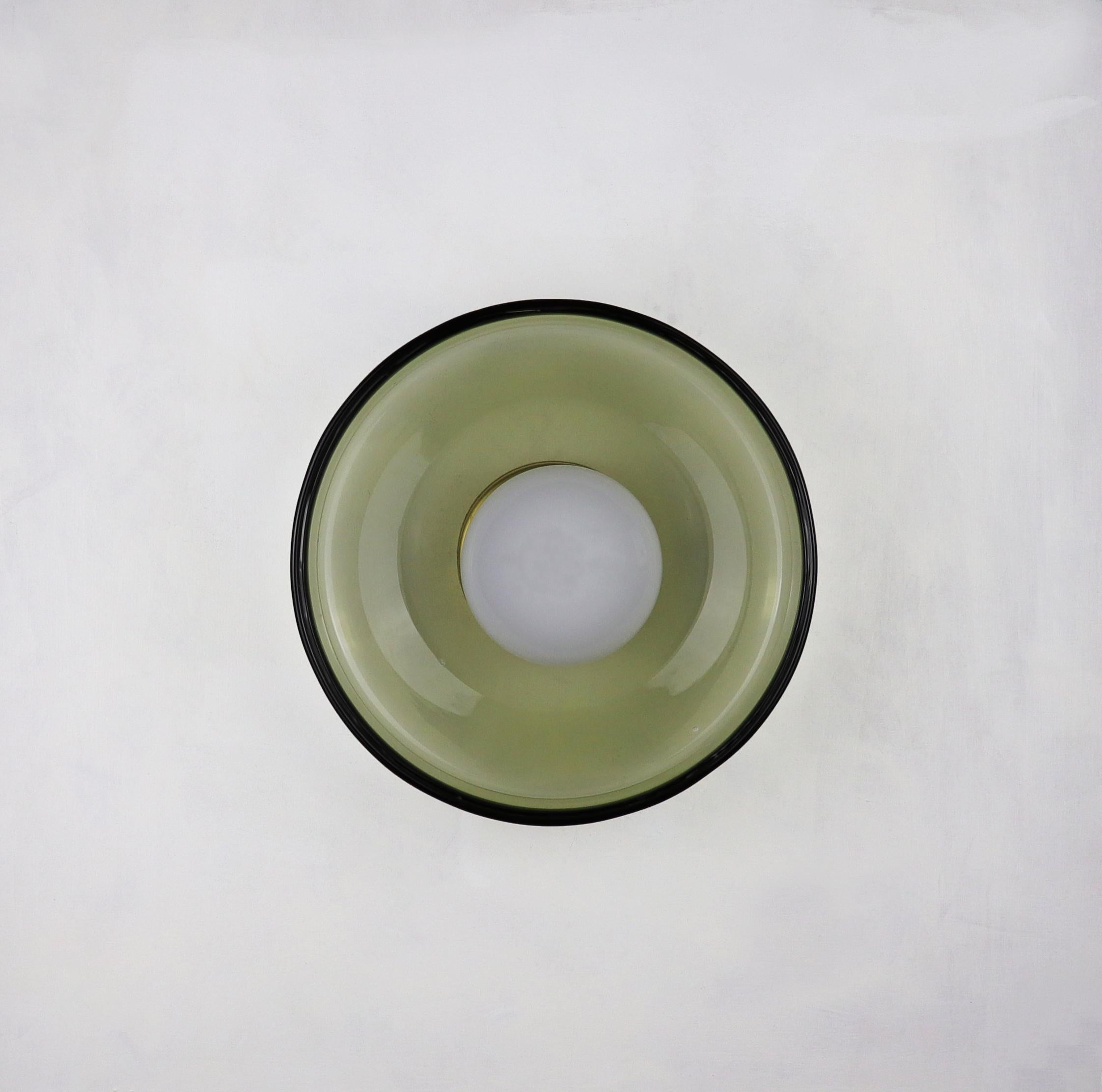 LIGHT OBJECT 030.2
Wall light

The large wall light is a statement piece, crafted from hand-blown glass. Its generous scale allows it to add an atmospheric glow to the space.